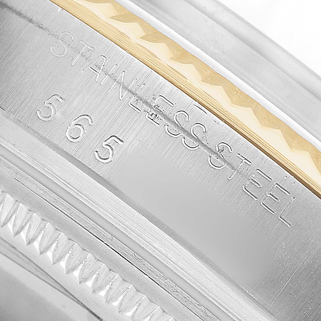 The image shows a close-up of the Rolex Datejust 16013 Men's Steel and Gold (two tone) Champagne Dial watch case, highlighting the stainless steel engravings.