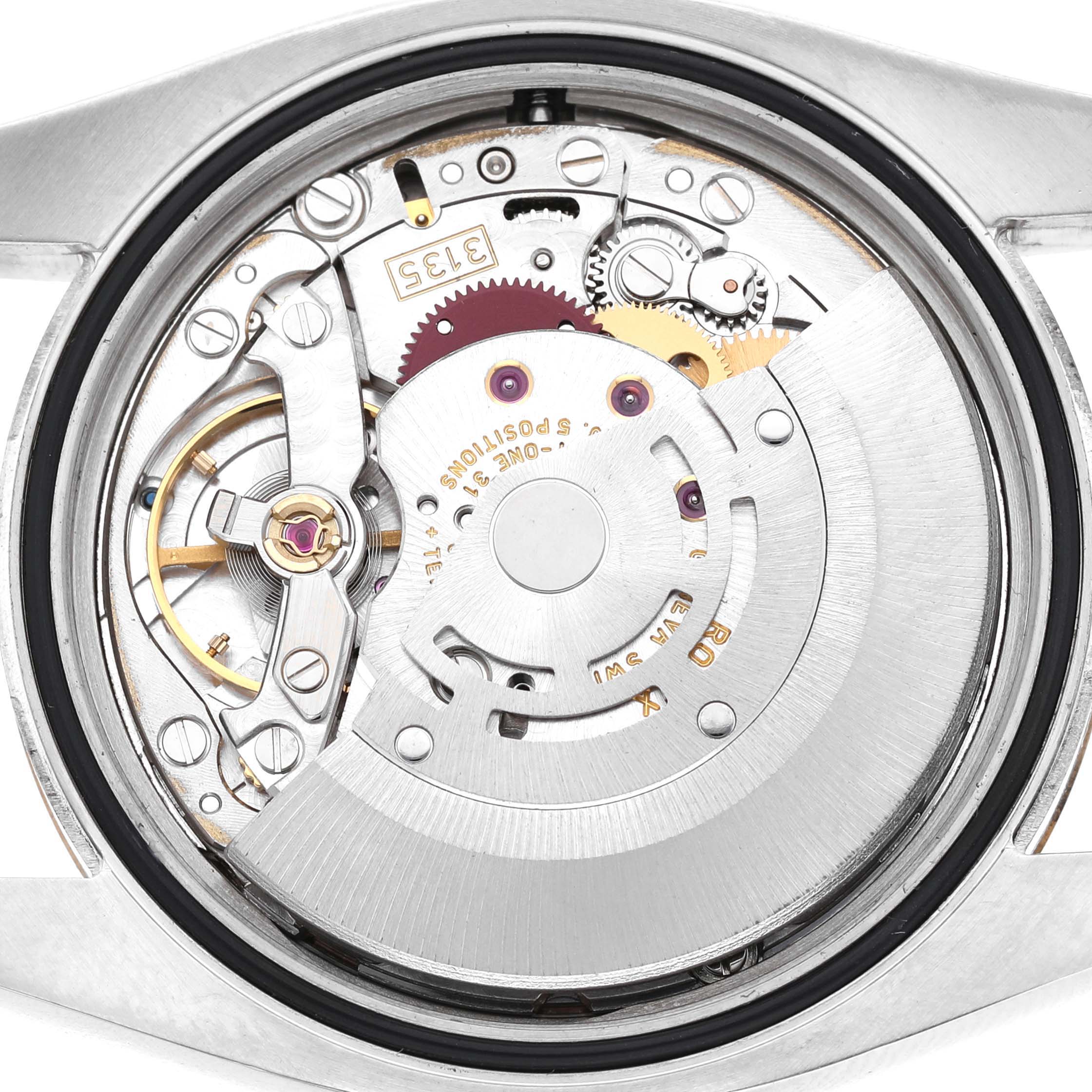 The image shows the movement mechanism of a Rolex Datejust 116233 Men's Stainless Steel Champagne Dial watch from the back, highlighting gears and components.