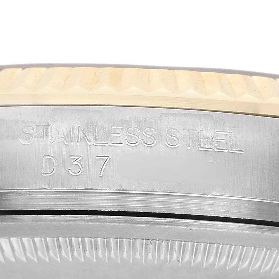 The image shows a close-up of the Rolex Datejust 116233 Men's Stainless Steel Champagne Dial's side, highlighting the stainless steel case and engraved details.