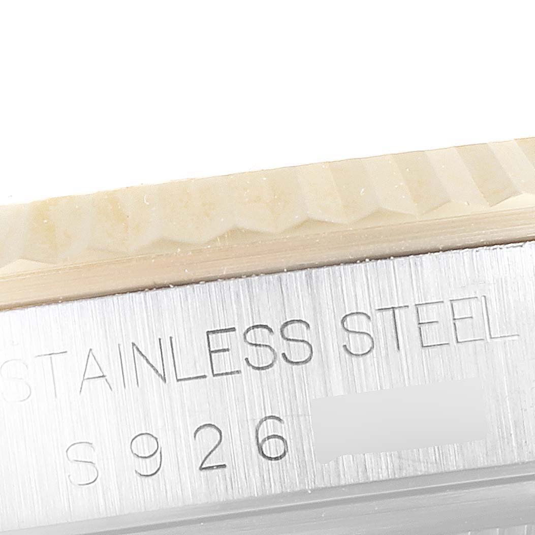 The image shows a close-up of the engraved stainless steel back or side of a Rolex Datejust 16233 Men's Steel and Gold (two tone) Champagne Dial 16233 Men's Steel and Gold (two tone) Champagne Dial watch.