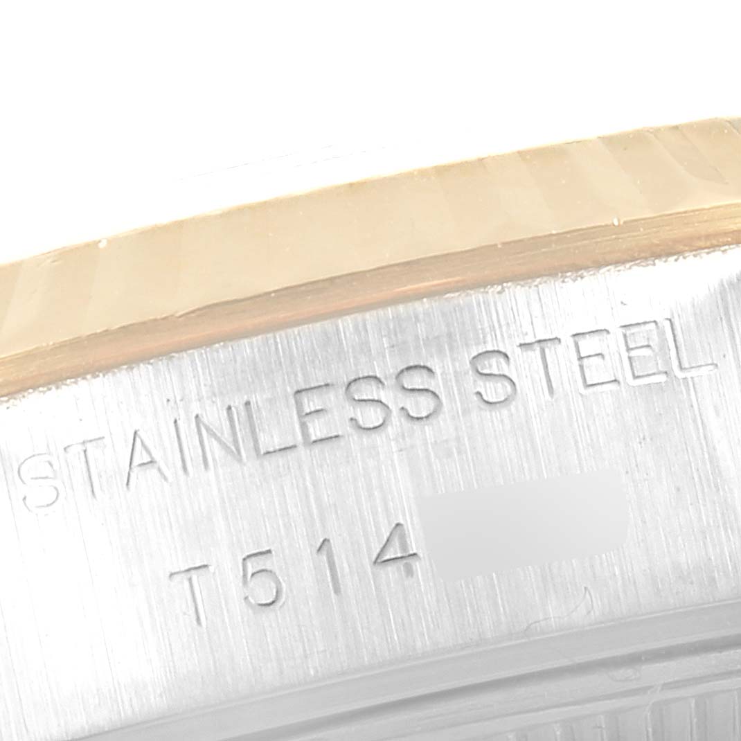 This image shows the side angle of a Rolex Datejust 69173 Women
s Steel and Gold (two tone) Grey Dial 69173 Women
s Steel and Gold (two tone) Grey Dial watch, highlighting its stainless steel case with engraved text.