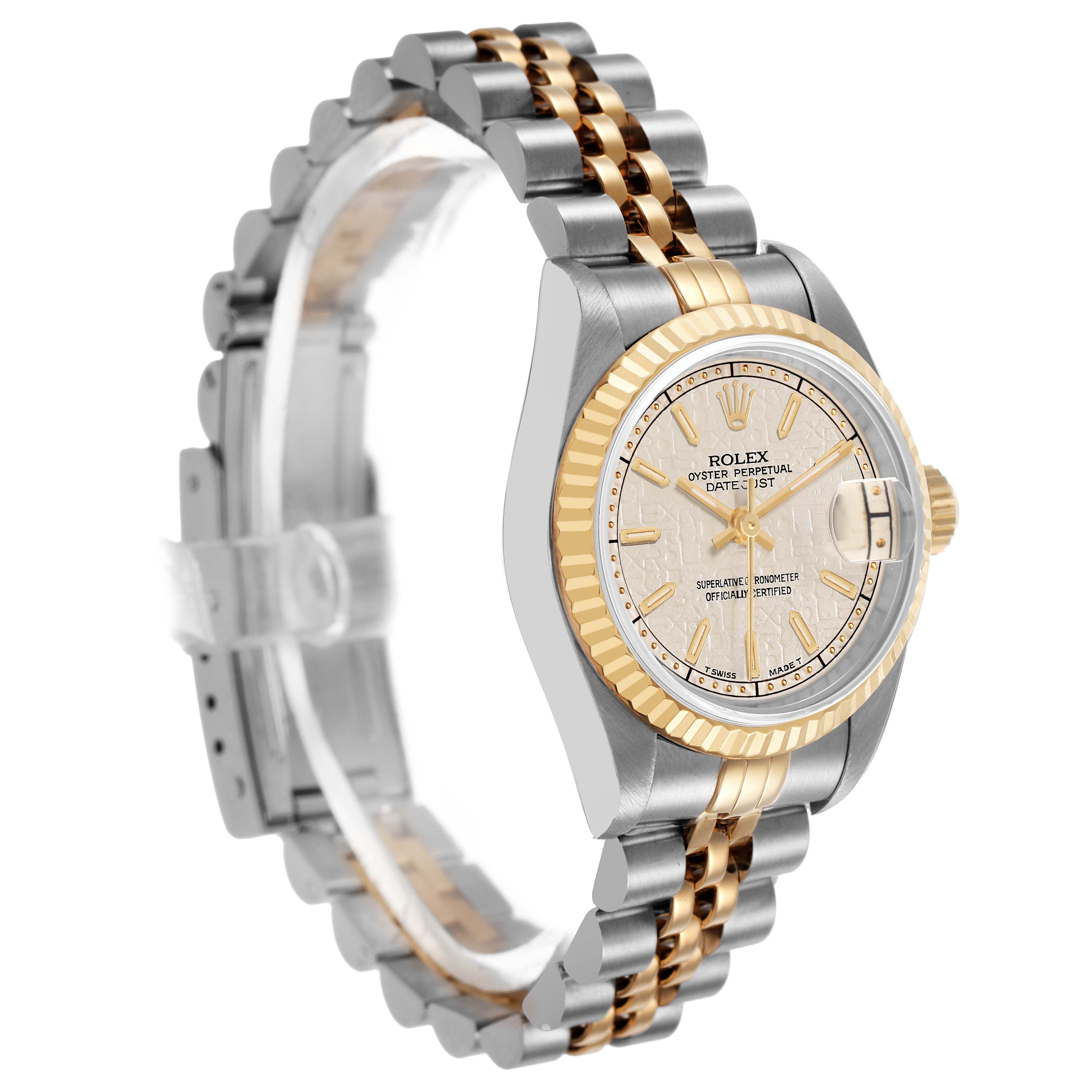 The Rolex Datejust 69173 Women's Steel and Gold (two tone) White Dial watch is shown at a three-quarter angle, displaying the face, jubilee bracelet, and fluted bezel.