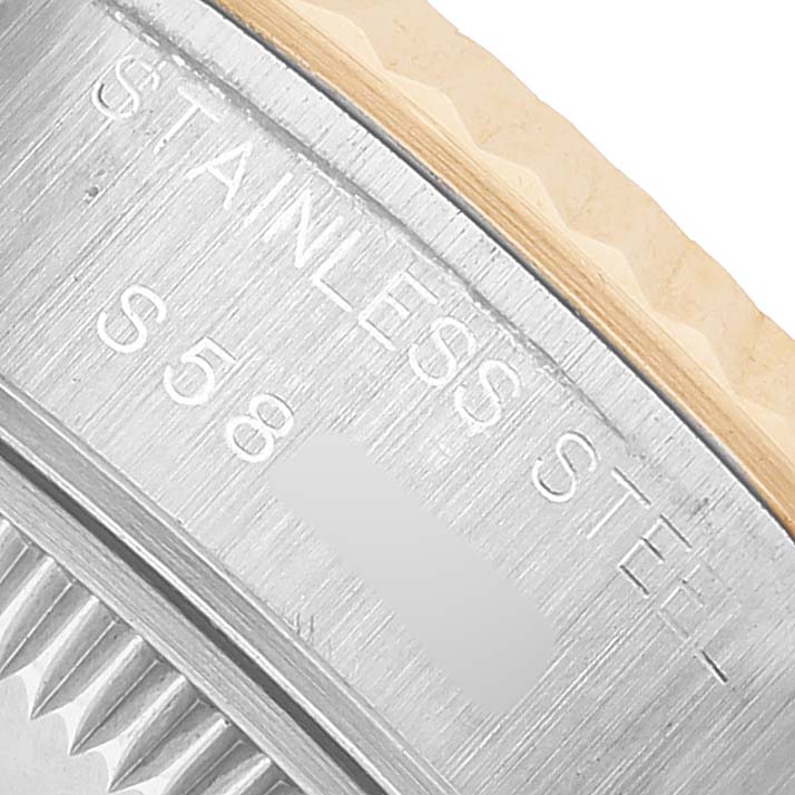 The image shows a close-up of the Rolex Datejust 69173 Women's Steel and Gold (two tone) White Dial's stainless steel case back, highlighting the material engraving.