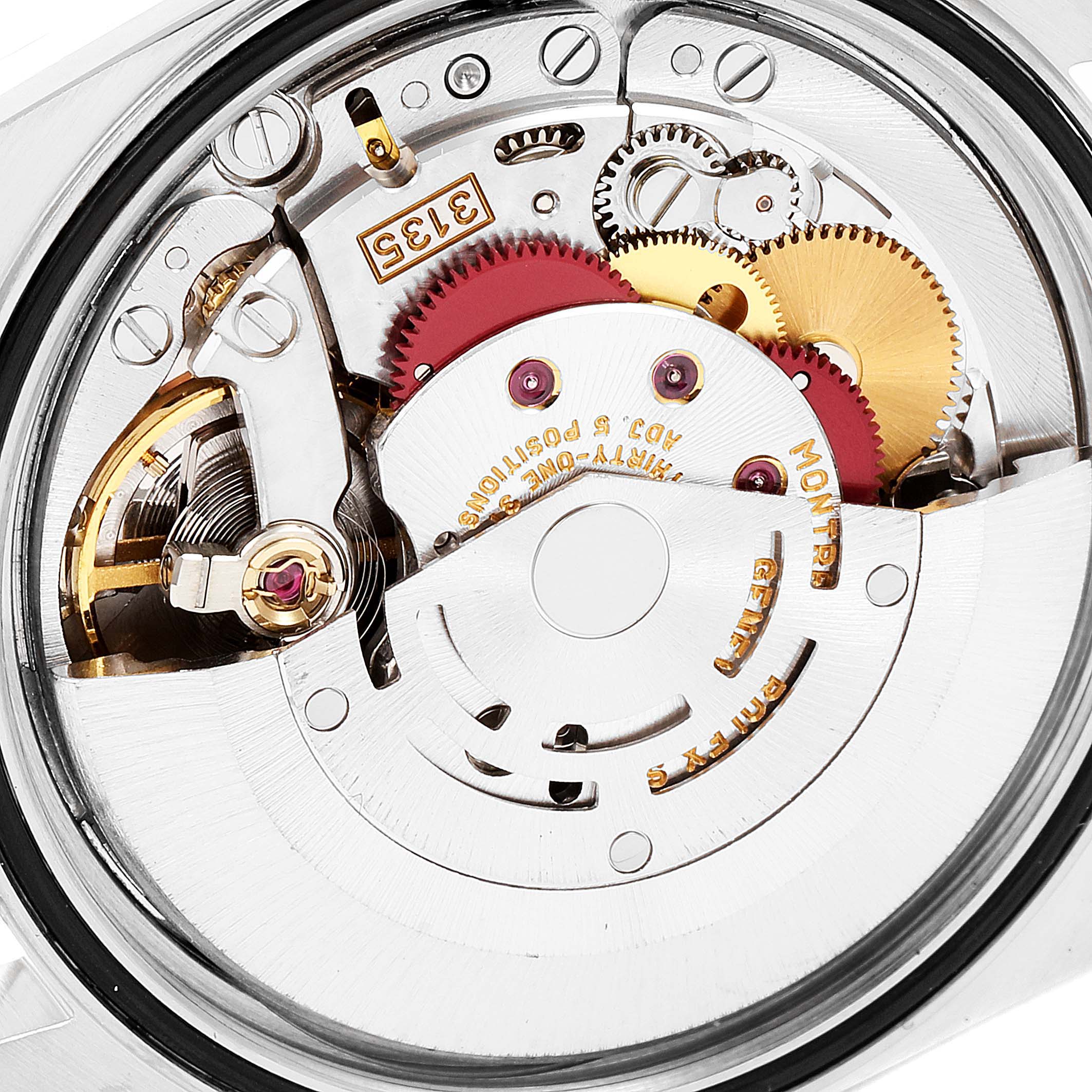 The image shows a close-up view of the internal movement mechanism of the Rolex Datejust 16233 Men's Steel and Gold (two tone) Mother of Pearl Dial 16233 Men's Steel and Gold (two tone) Mother of Pearl Dial watch, highlighting its intricate gears and components.