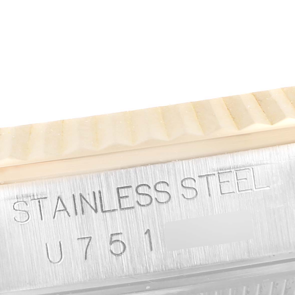 The image shows a close-up of the stainless steel engraving on the side case of a Rolex Datejust 16233 Men
s Steel and Gold (two tone) Grey Dial 16233 Men
s Steel and Gold (two tone) Grey Dial watch.