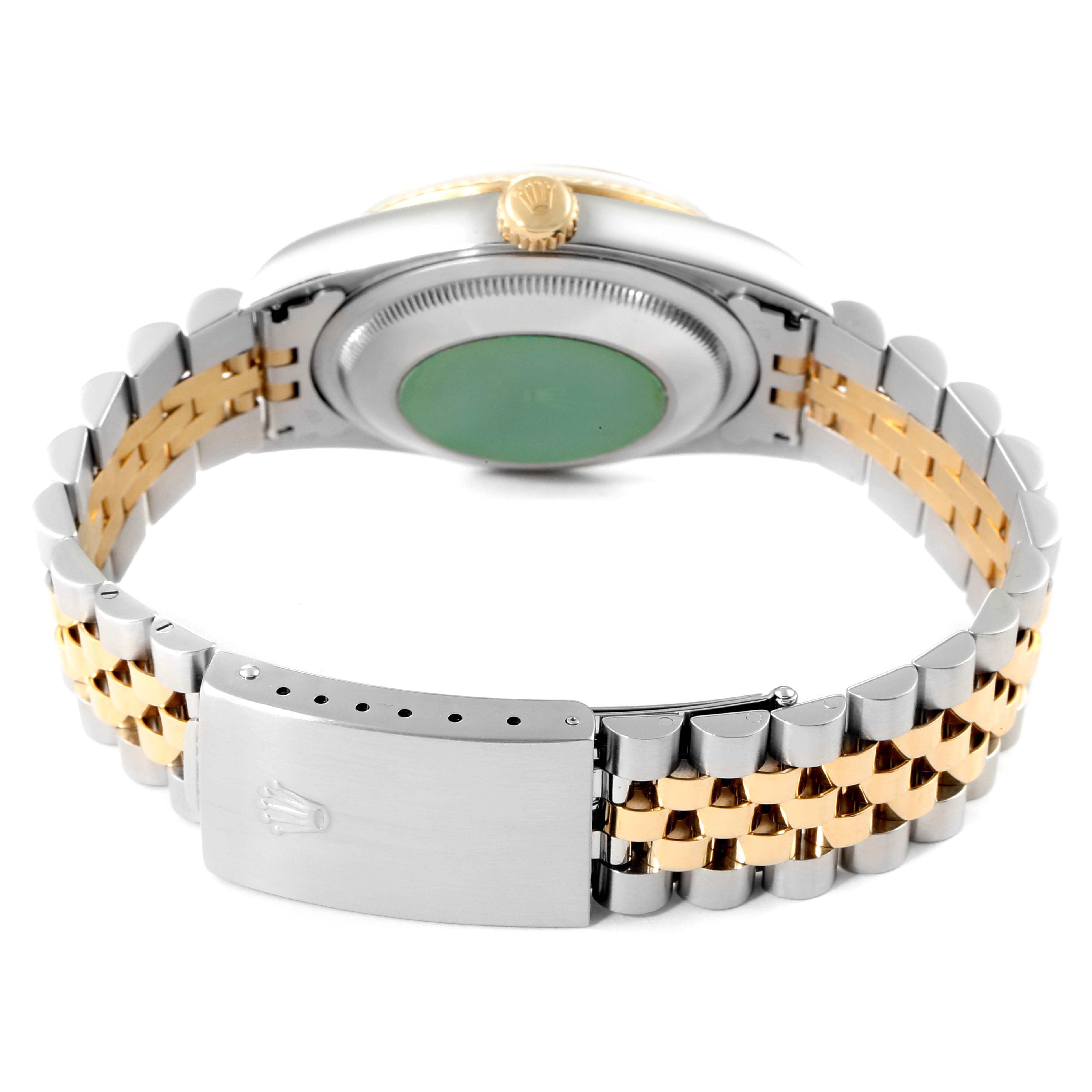 The image shows the back view of a Rolex Datejust 16233 Men
s Steel and Gold (two tone) Grey Dial 16233 Men
s Steel and Gold (two tone) Grey Dial watch with its two-tone bracelet and clasp.