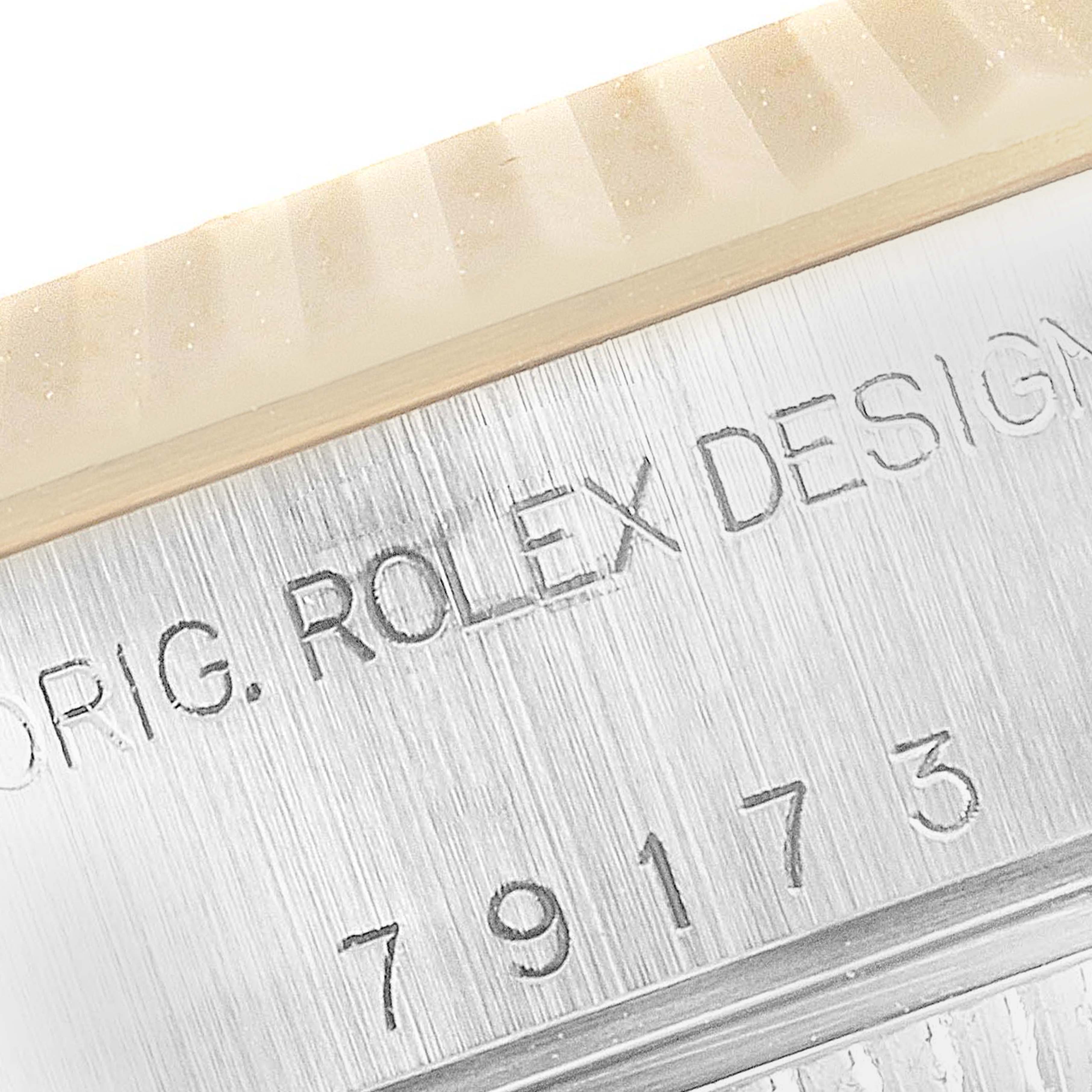 This image shows a close-up of the model and serial number engraving on the side of a Rolex Datejust 79173 Women's Steel and Gold (two tone) White Dial 79173 Women's Steel and Gold (two tone) White Dial watch case.