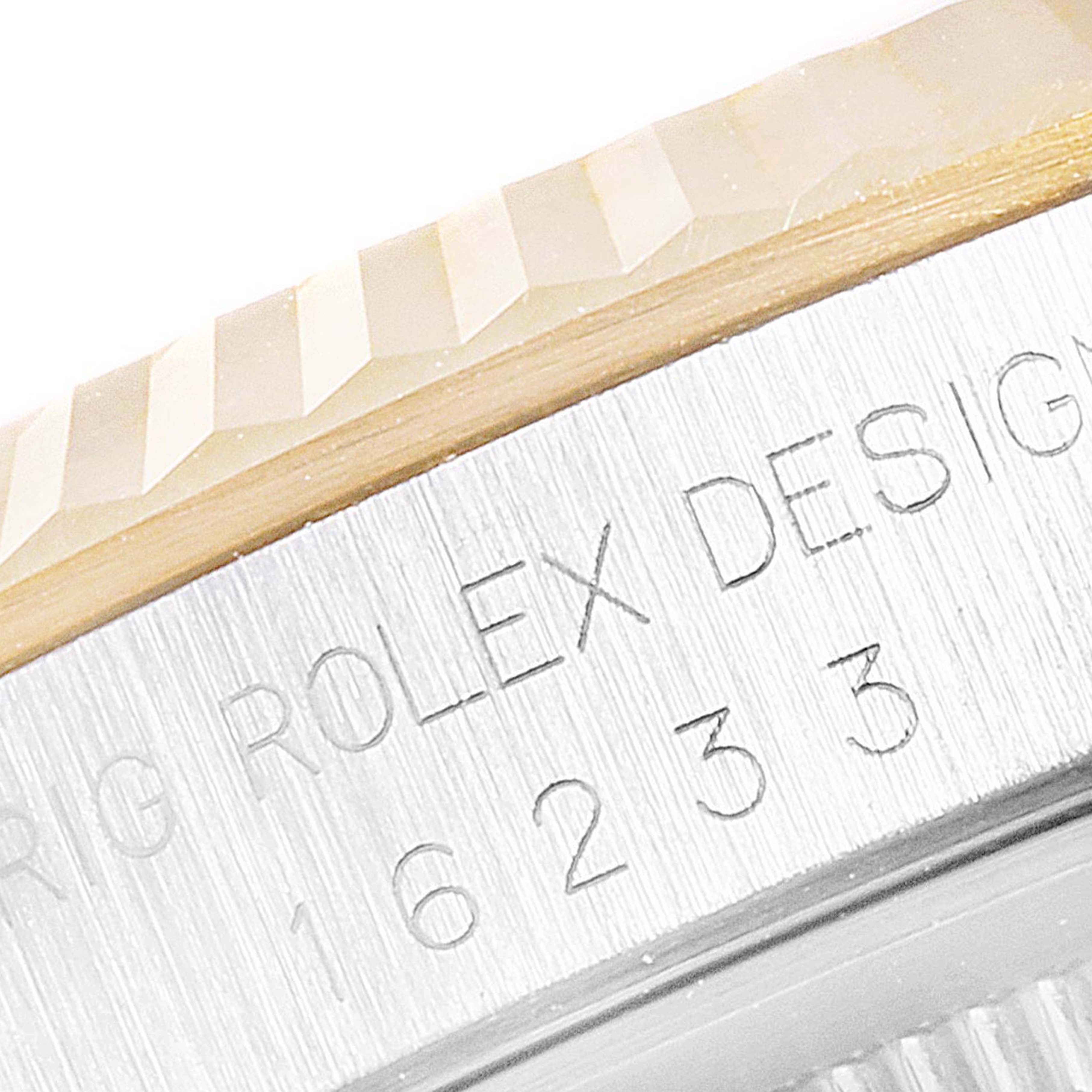 This close-up image shows the engraved bezel and case side of the Rolex Datejust 16233 Men's Steel and Gold (two tone) White Dial 16233 Men's Steel and Gold (two tone) White Dial watch.