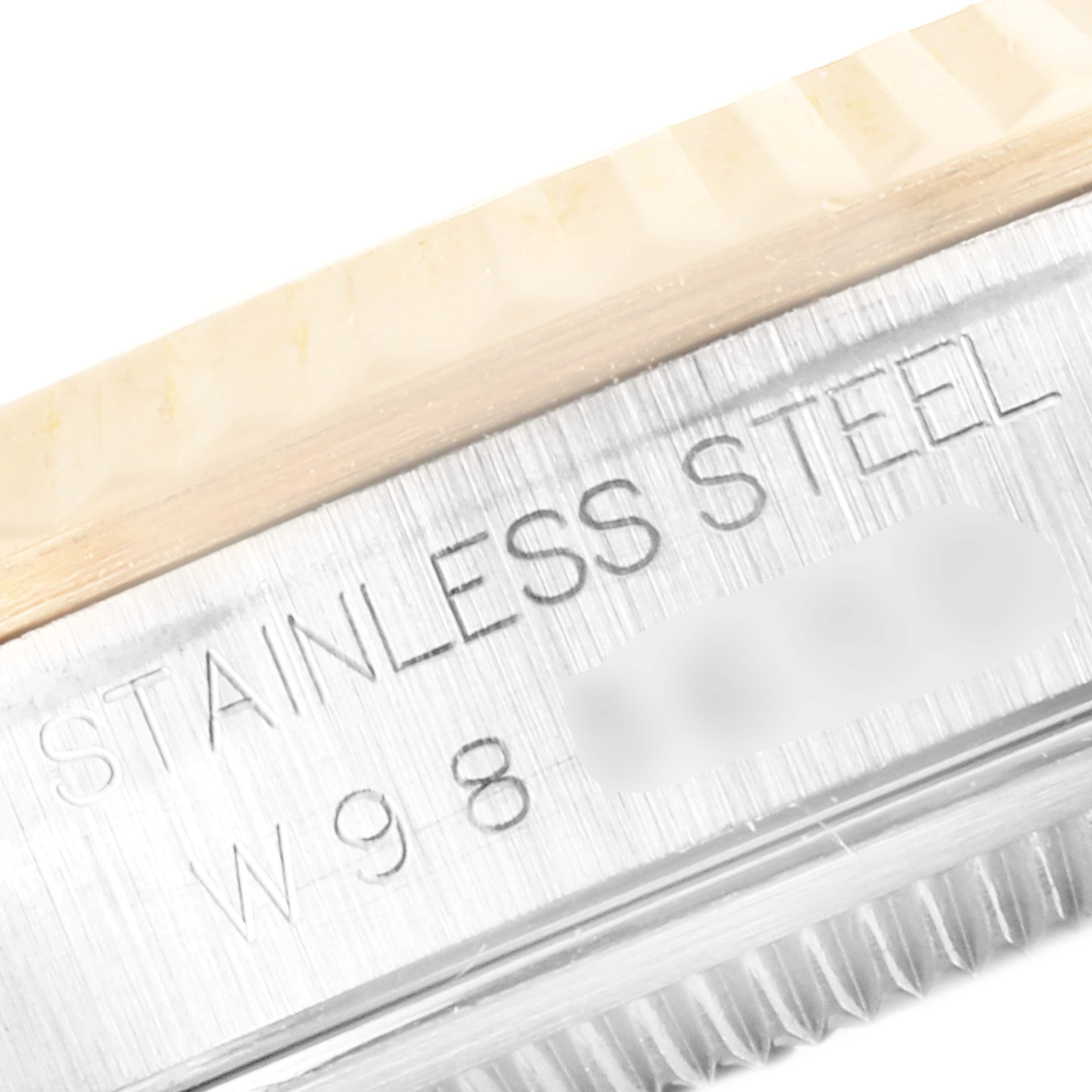 The image shows a close-up of the engraved text "STAINLESS STEEL" on the casing edge of a Rolex Datejust 16233 Men's Steel and Gold (two tone) White Dial 16233 Men's Steel and Gold (two tone) White Dial watch.