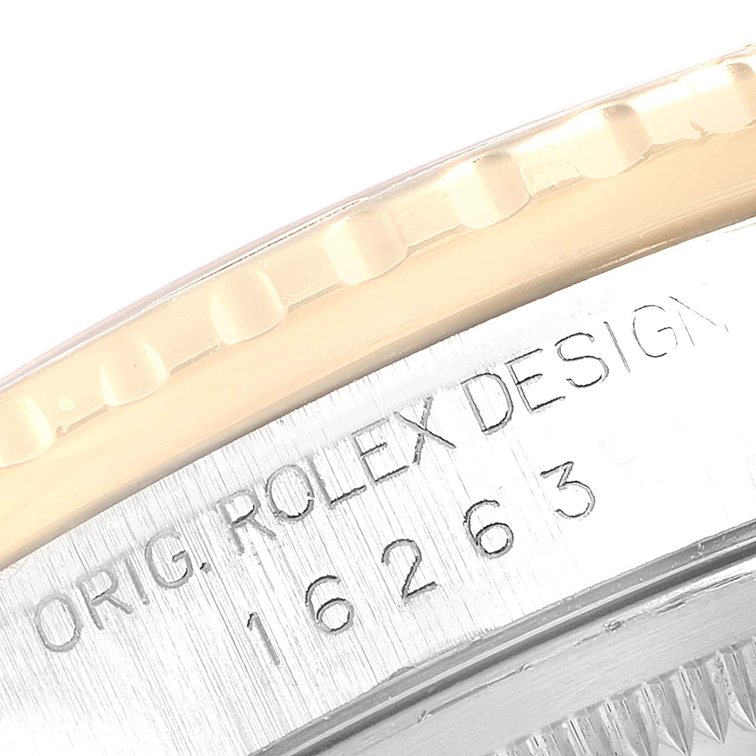 The image shows a close-up of the bezel and casing of a Rolex Turn-o-Graph 16263 Men
s Steel and Gold (two tone) Champagne Dial 16263 Men
s Steel and Gold (two tone) Champagne Dial model, highlighting the serial and model numbers.
