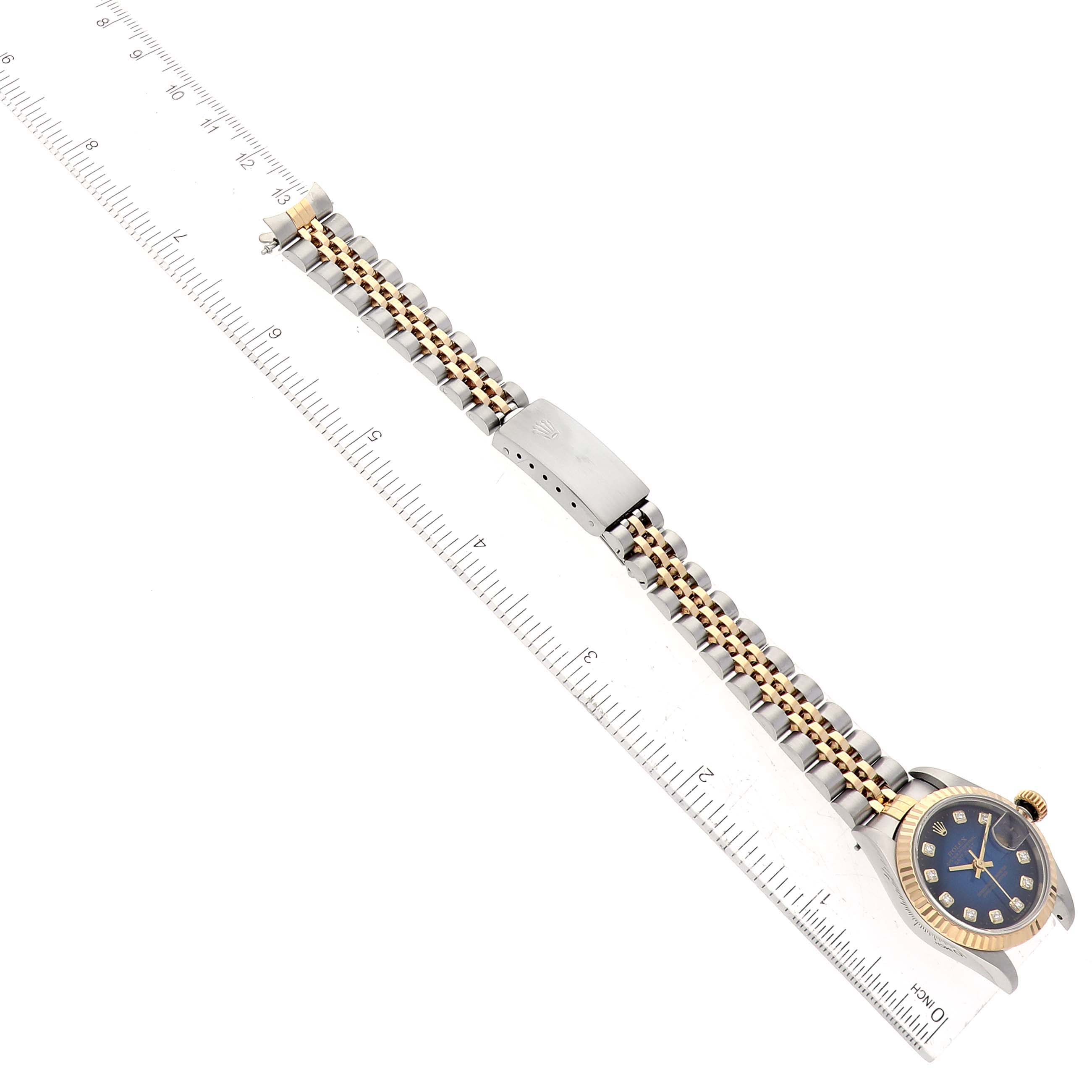 The image shows an overhead view of a Rolex Datejust 69173 Women's Steel and Gold (two tone) Blue Dial 69173 Women's Steel and Gold (two tone) Blue Dial watch, displaying the band, clasp, and part of the watch face.