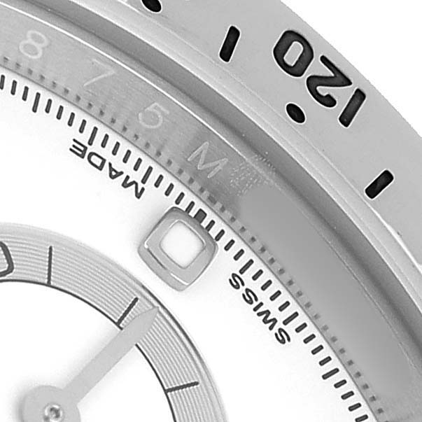 The image shows a close-up of the dial, indices, and bezel markings of a Rolex Daytona 116520 Men's Stainless Steel White Dial.