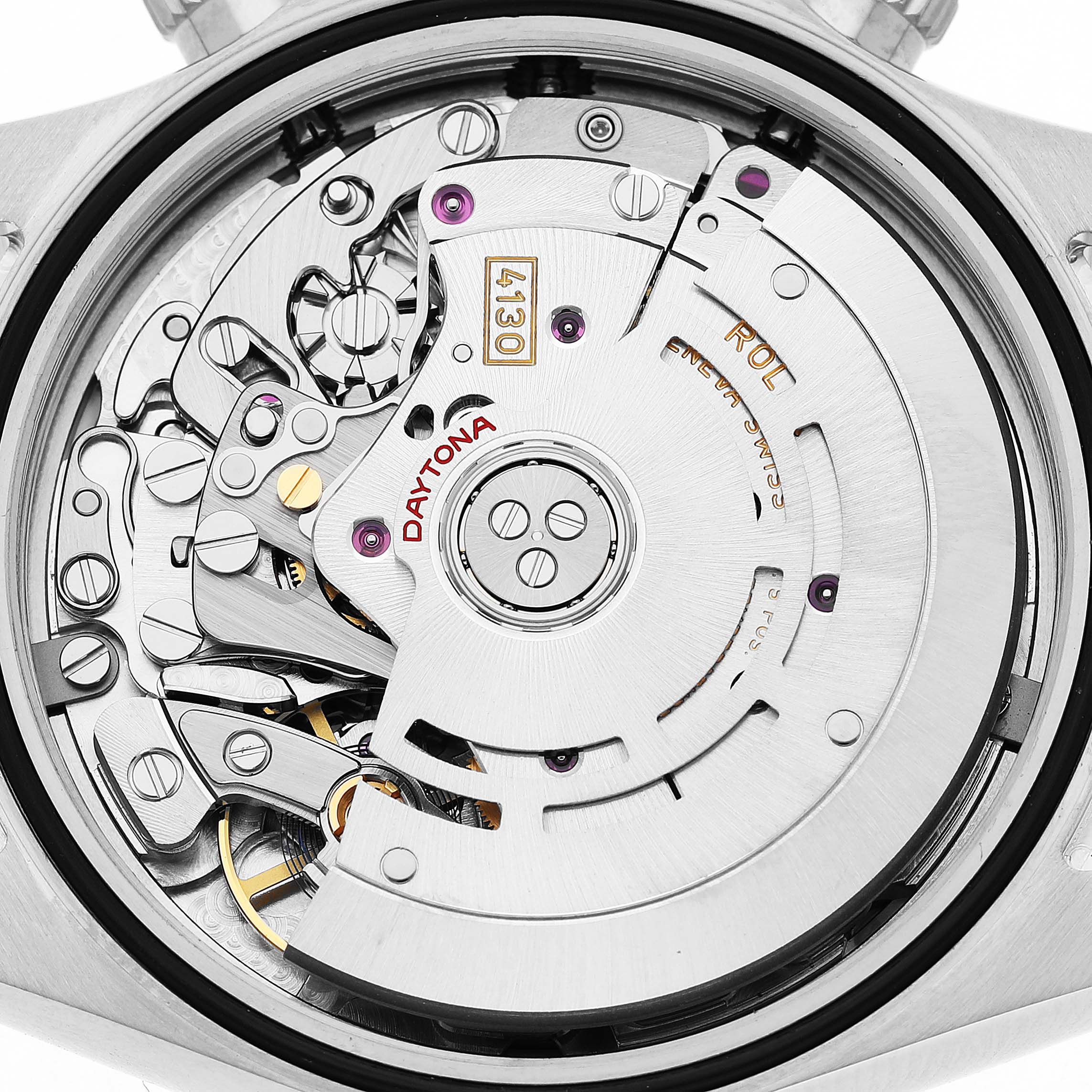 The image shows the movement of a Rolex Daytona 116520 Men's Stainless Steel White Dial watch from a back angle, highlighting its intricate internal mechanisms.