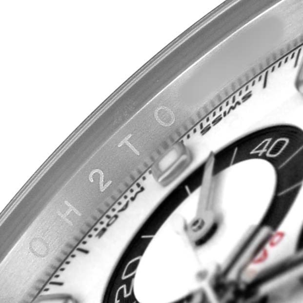 The image shows a close-up of the Rolex Daytona 116500LN Men's Stainless Steel White Dial watch face, focusing on the dial, hands, and part of the bezel.