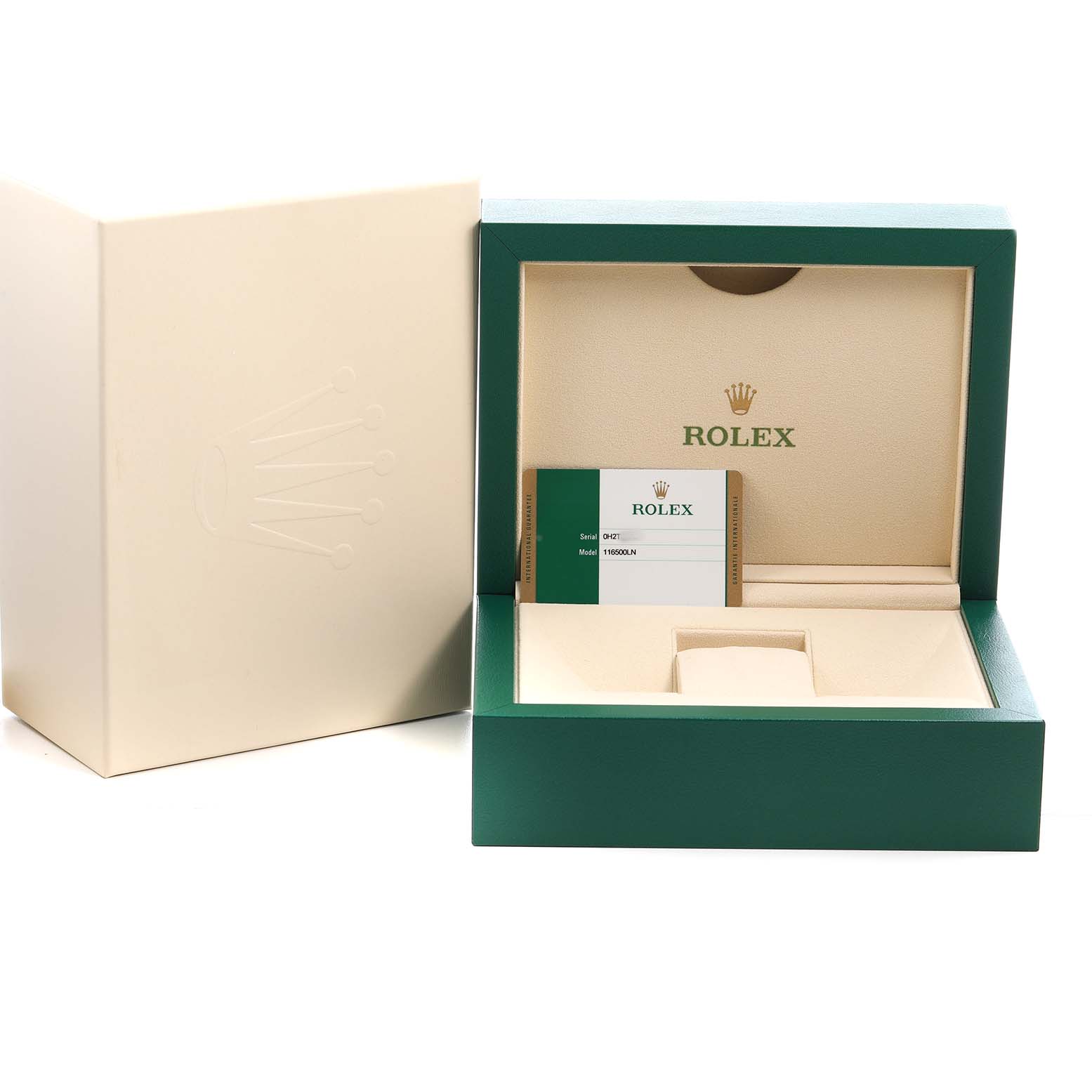The image shows the open box for a Rolex Daytona 116500LN Men's Stainless Steel White Dial watch, featuring its green and beige interior, a warranty card, and outer packaging.