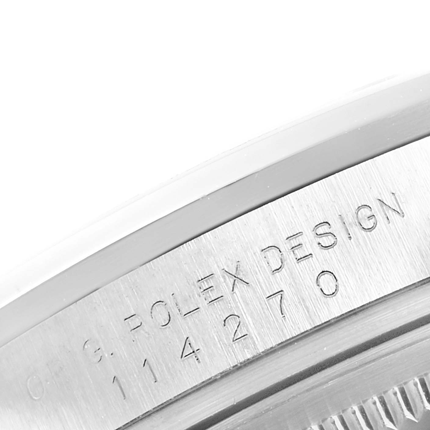 This image shows a close-up of the engraved side of the casing of a Rolex Explorer 114270  Men
s Stainless Steel Black Dial 114270  Men
s Stainless Steel Black Dial watch, detailing the model and brand.