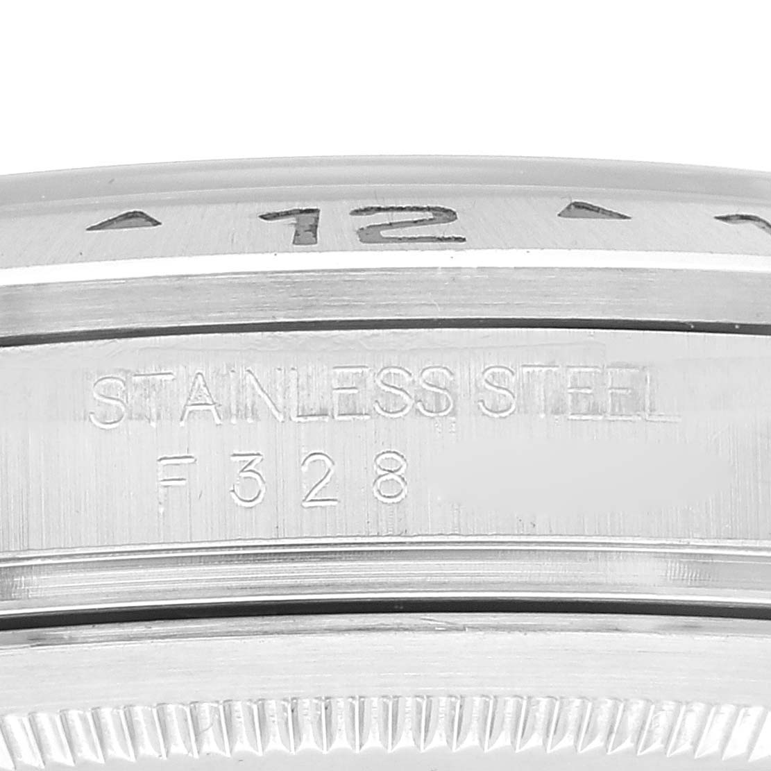 The close-up image shows the side engraving of the bezel and case of a Rolex Explorer 16570 Men
s Stainless Steel White Dial 16570 Men
s Stainless Steel White Dial watch.