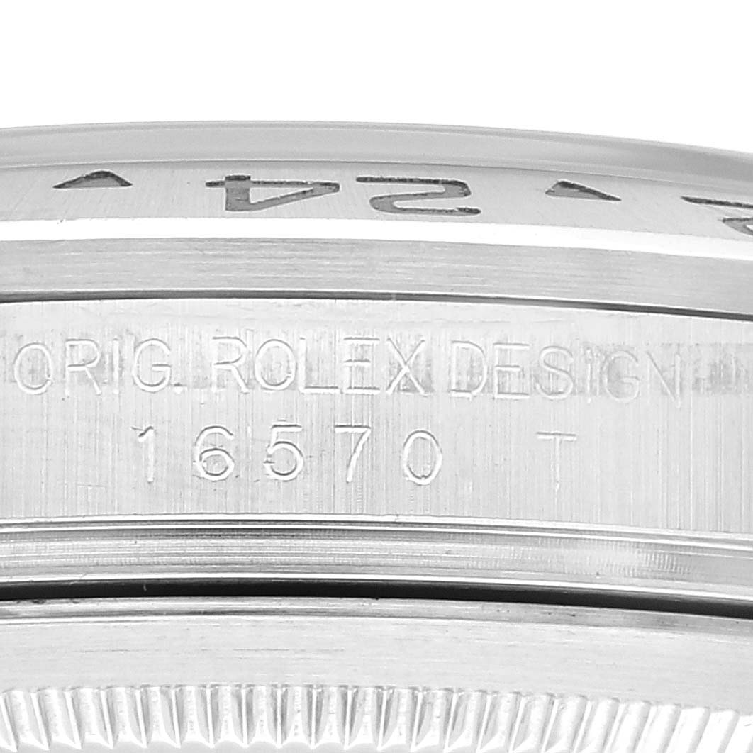 This image shows a close-up of the engraved side of the case and bezel of a Rolex Explorer 16570 Men
s Stainless Steel White Dial 16570 Men
s Stainless Steel White Dial model 16570 watch.