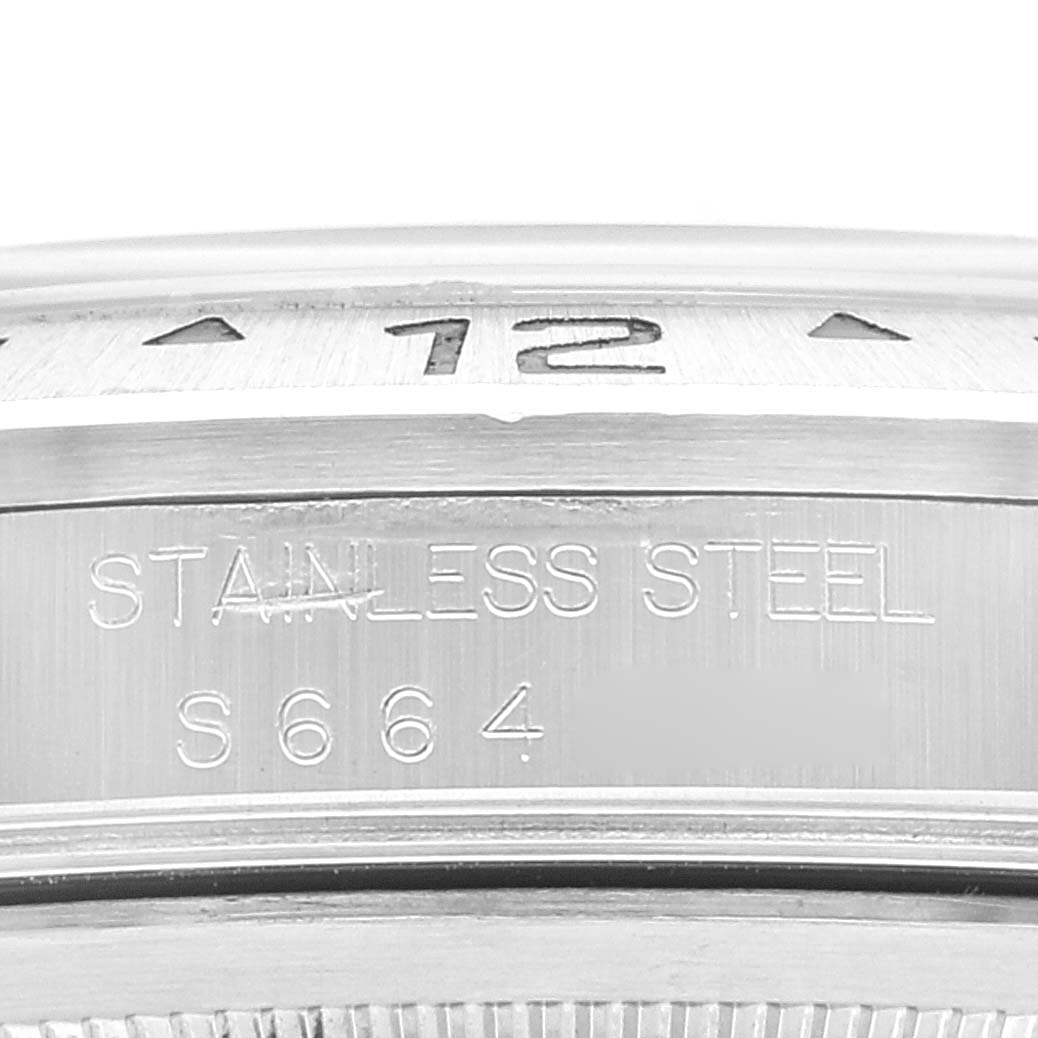 This image shows a close-up of the stainless steel bezel and part of the engraved outer ring of a Rolex Explorer 16570 Men's Stainless Steel Black Dial 16570 Men's Stainless Steel Black Dial watch.