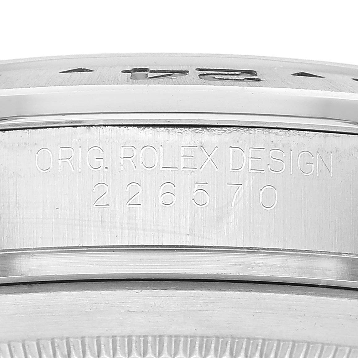 Close-up of the model number on the case side of a Rolex Explorer 226570 Men
s Stainless Steel White Dial 226570 Men
s Stainless Steel White Dial watch, showing "ORIG. ROLEX DESIGN 226570."