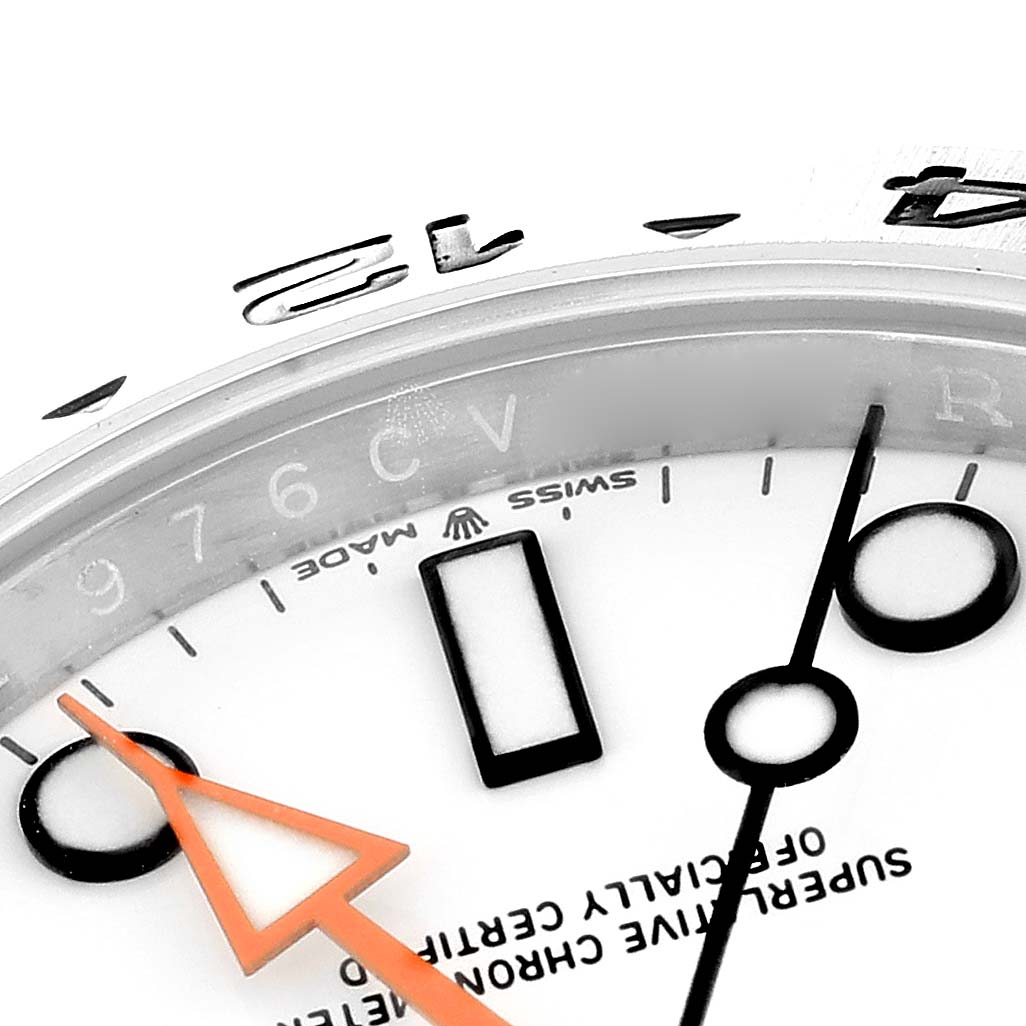 This image shows a close-up of the Rolex Explorer 226570 Men
s Stainless Steel White Dial 226570 Men
s Stainless Steel White Dial watch dial, focusing on the hour markers and hands from an oblique angle.