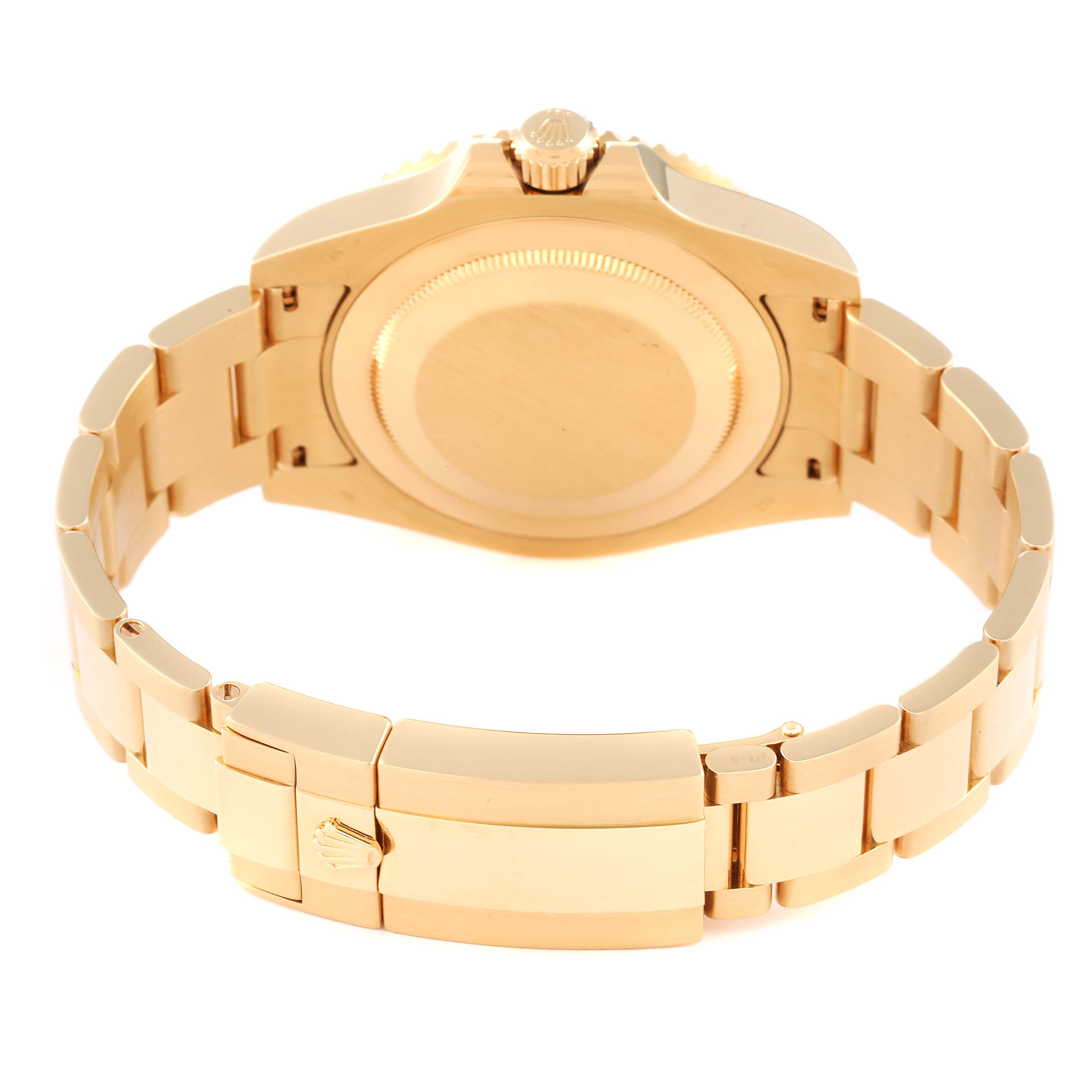 This image shows the backside and the bracelet of a Rolex GMT-Master 116718 Men's Yellow Gold Green Dial 116718 Men's Yellow Gold Green Dial watch.