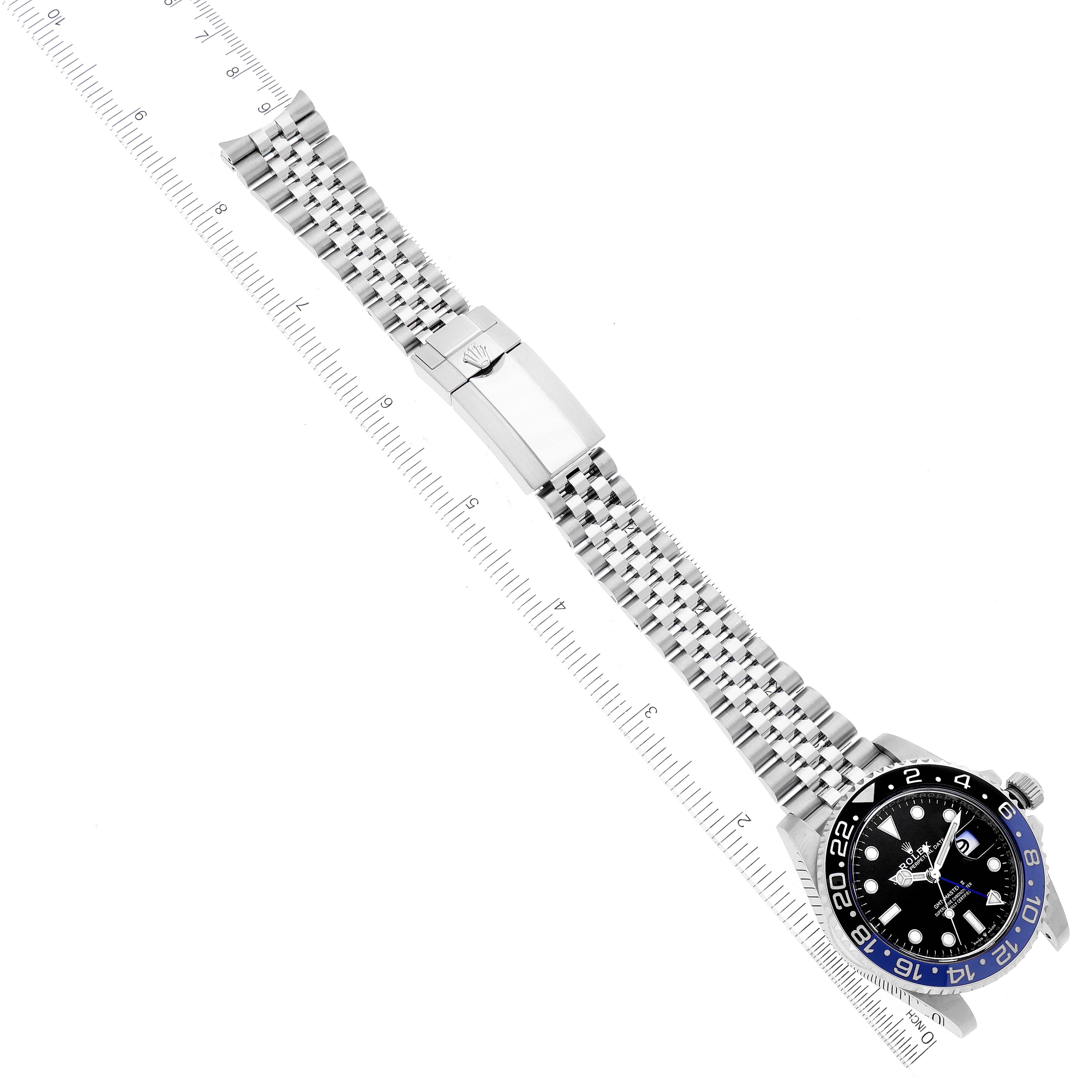 The image shows a top-down view of a Rolex GMT-Master 126710 Men
s Stainless Steel Black Dial 126710 Men
s Stainless Steel Black Dial watch, including the dial, bezel, and metal bracelet with clasp.