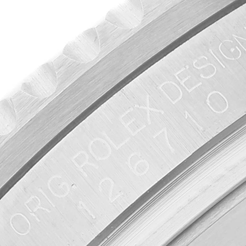 The image shows a close-up of the engraved inner bezel and case side of a Rolex GMT-Master 126710 Men
s Stainless Steel Black Dial 126710 Men
s Stainless Steel Black Dial watch.