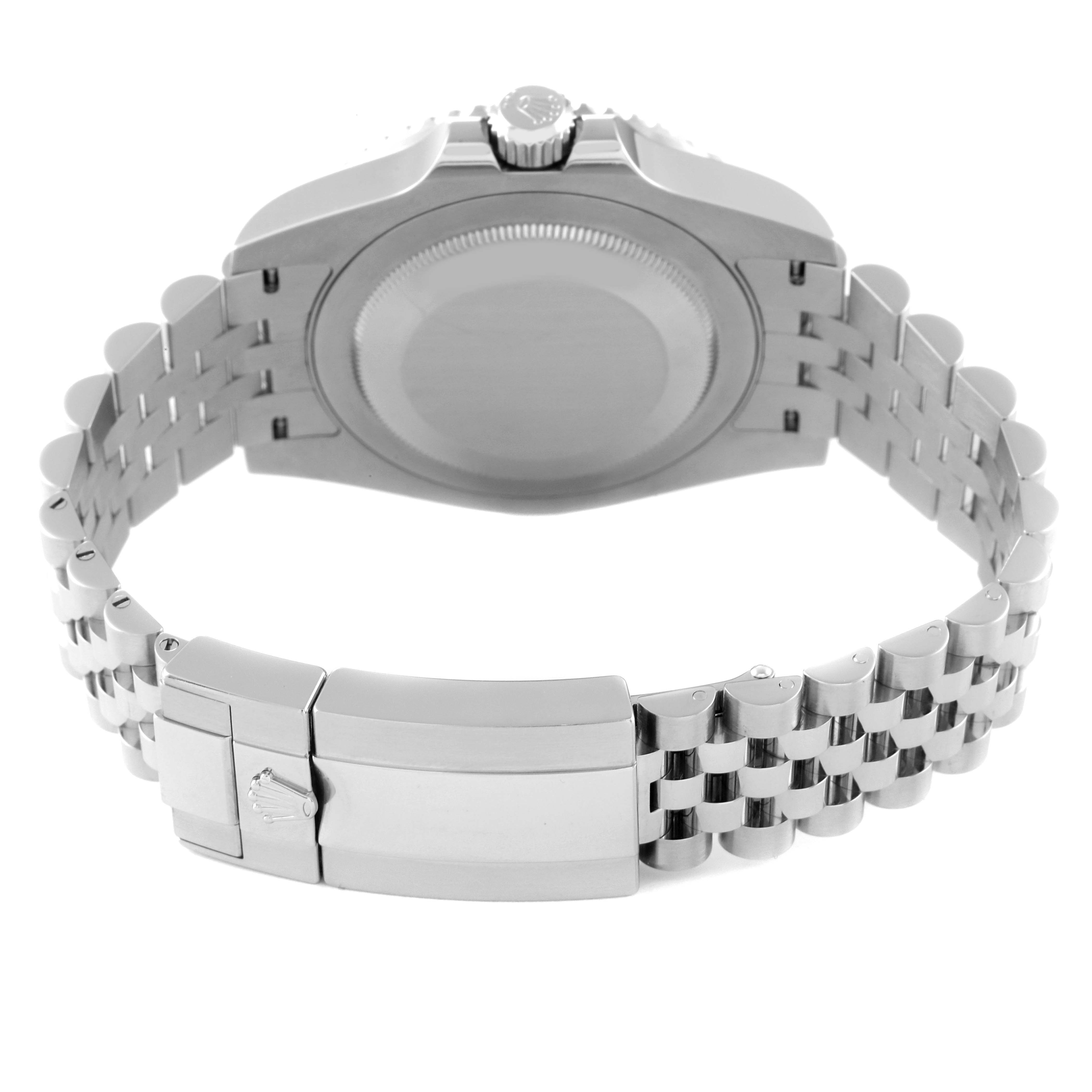 The image shows the back case, crown, and bracelet clasp of a Rolex GMT-Master 126710 Men
s Stainless Steel Black Dial 126710 Men
s Stainless Steel Black Dial watch from a rear angle.