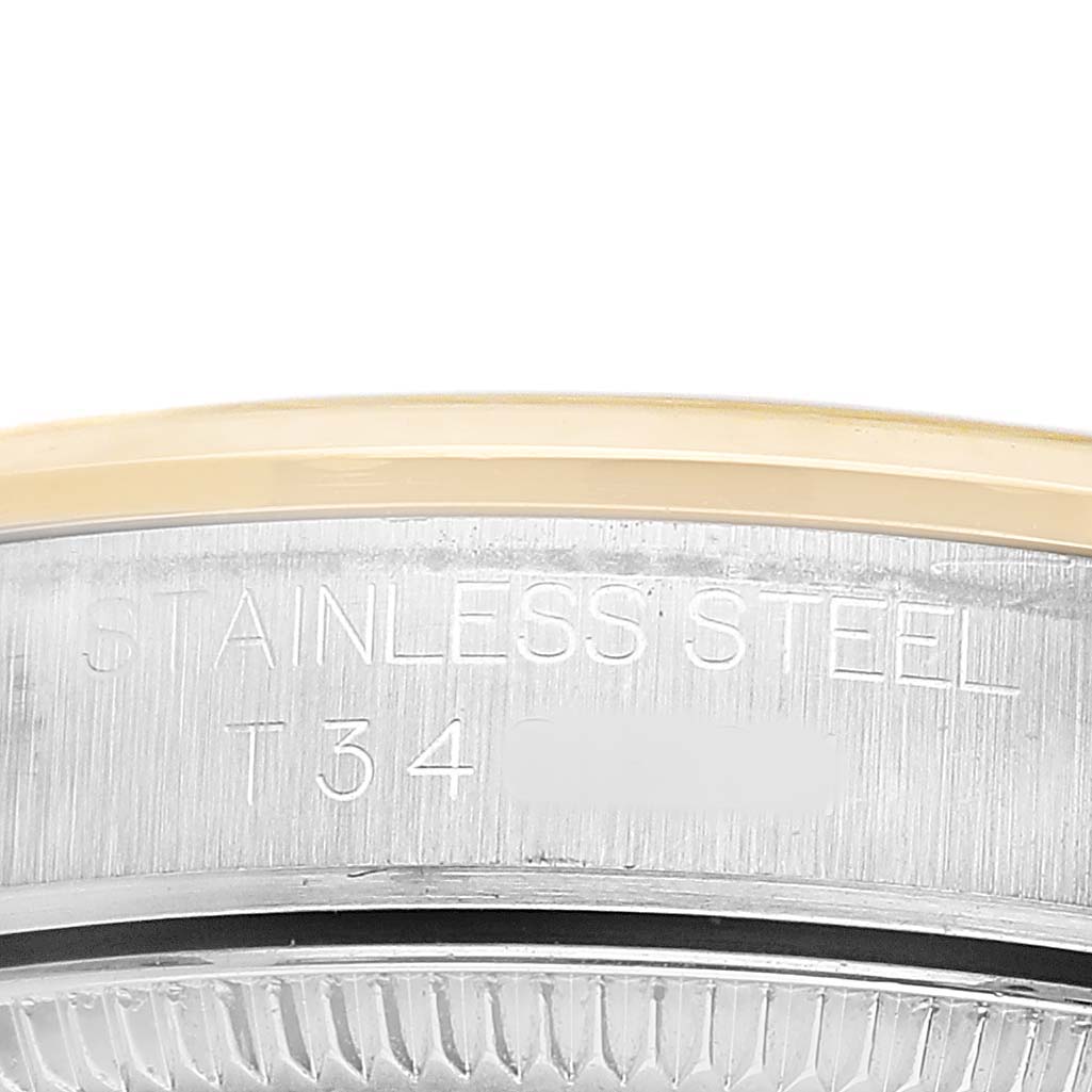 The image shows a close-up of the Rolex Oyster Perpetual 67483 Women's Steel and Gold (two tone) Grey Dial's side, focusing on its stainless steel inscription.