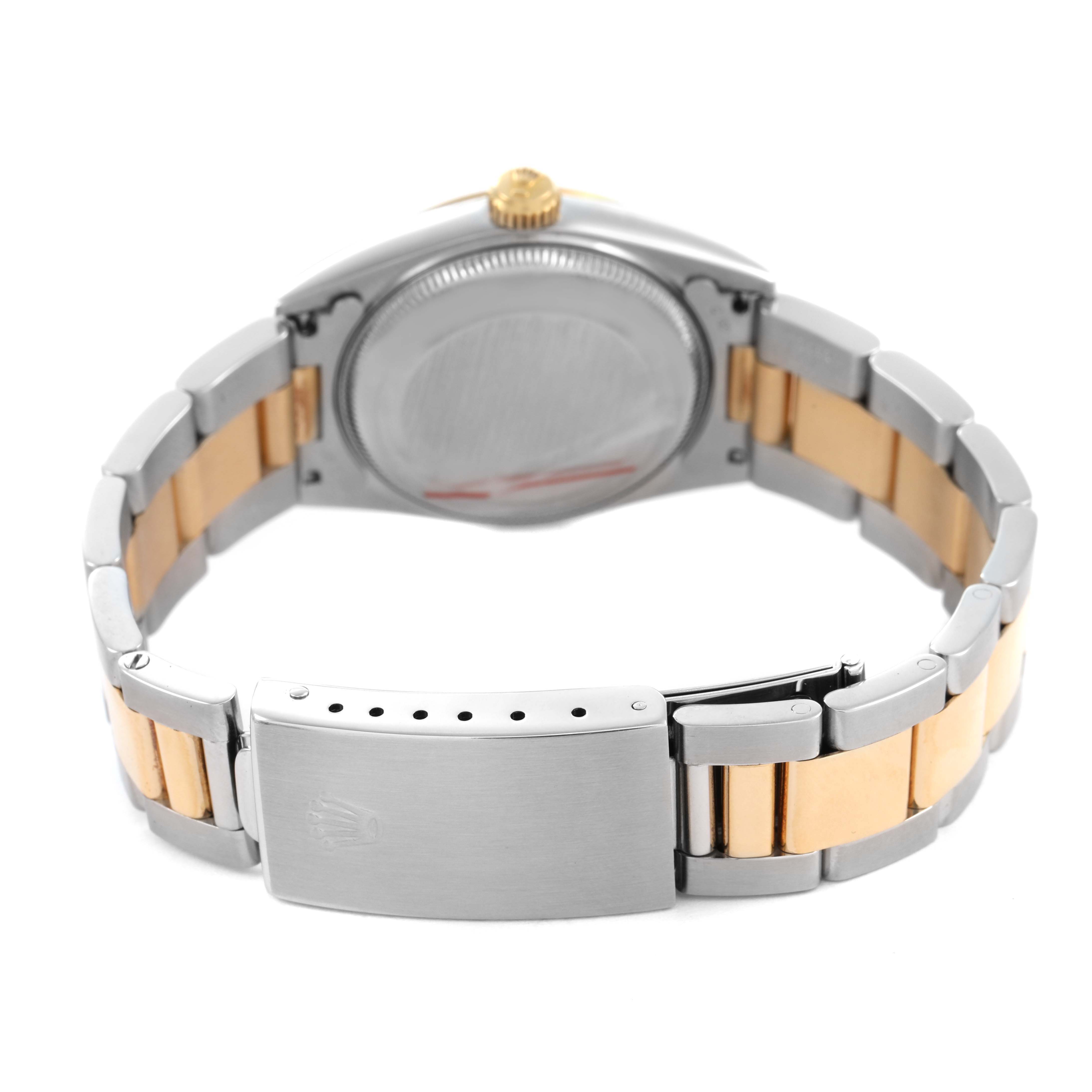 The image shows the back view of a Rolex Oyster Perpetual 67483 Women's Steel and Gold (two tone) Grey Dial, highlighting the clasp and brushed metal band.