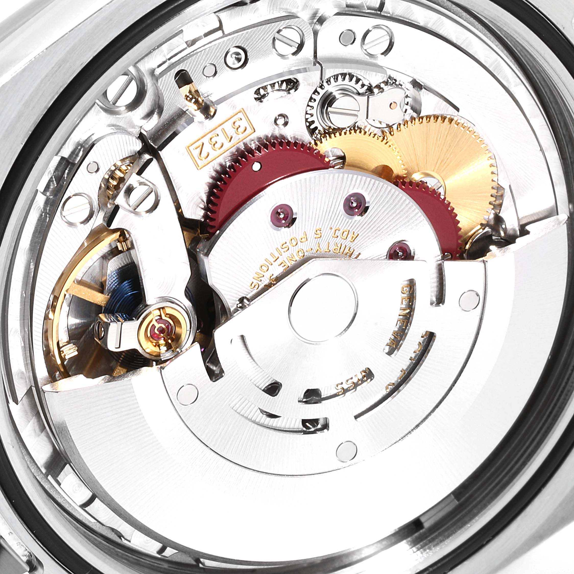 This image shows the internal mechanism of a Rolex Oyster Perpetual 114300 Men's Stainless Steel Black Dial 114300 Men's Stainless Steel Black Dial watch, highlighting its gears and movement parts.