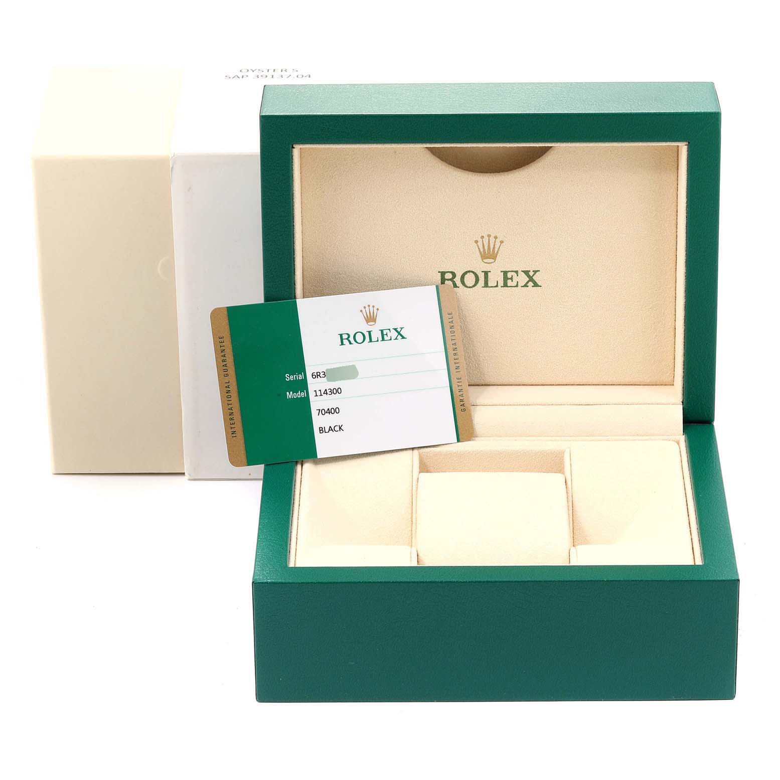 The image shows an opened Rolex box for the Oyster Perpetual model, with its guarantee card displayed.