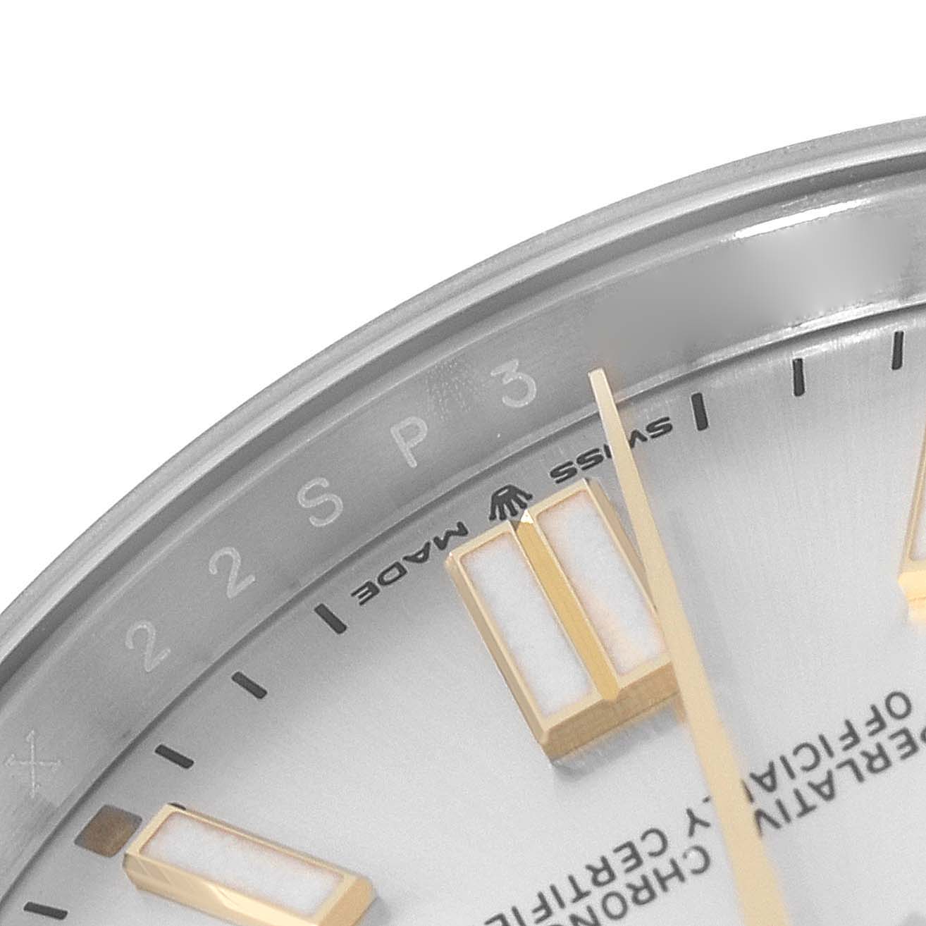 The image shows a close-up of the dial and hands of a Rolex Oyster Perpetual 124300 Men's Stainless Steel Silver Dial 124300 Men's Stainless Steel Silver Dial watch, including the "Swiss Made" marking and hour markers.