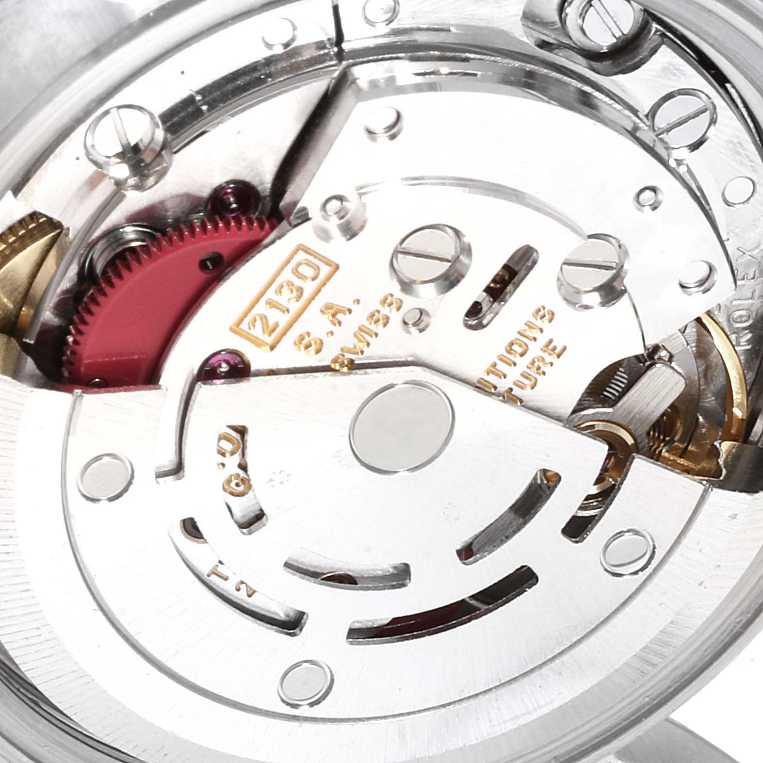 Close-up view of the movement inside the Rolex Oyster Perpetual 67180 Women
s Stainless Steel Black Dial 67180 Women
s Stainless Steel Black Dial watch, showing intricate mechanical parts and engravings.