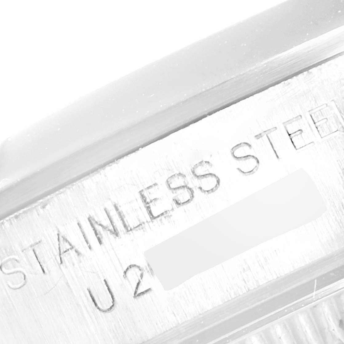 The image shows a close-up of the side of the stainless steel case of a Rolex Oyster Perpetual 67180 Women
s Stainless Steel Black Dial 67180 Women
s Stainless Steel Black Dial watch.