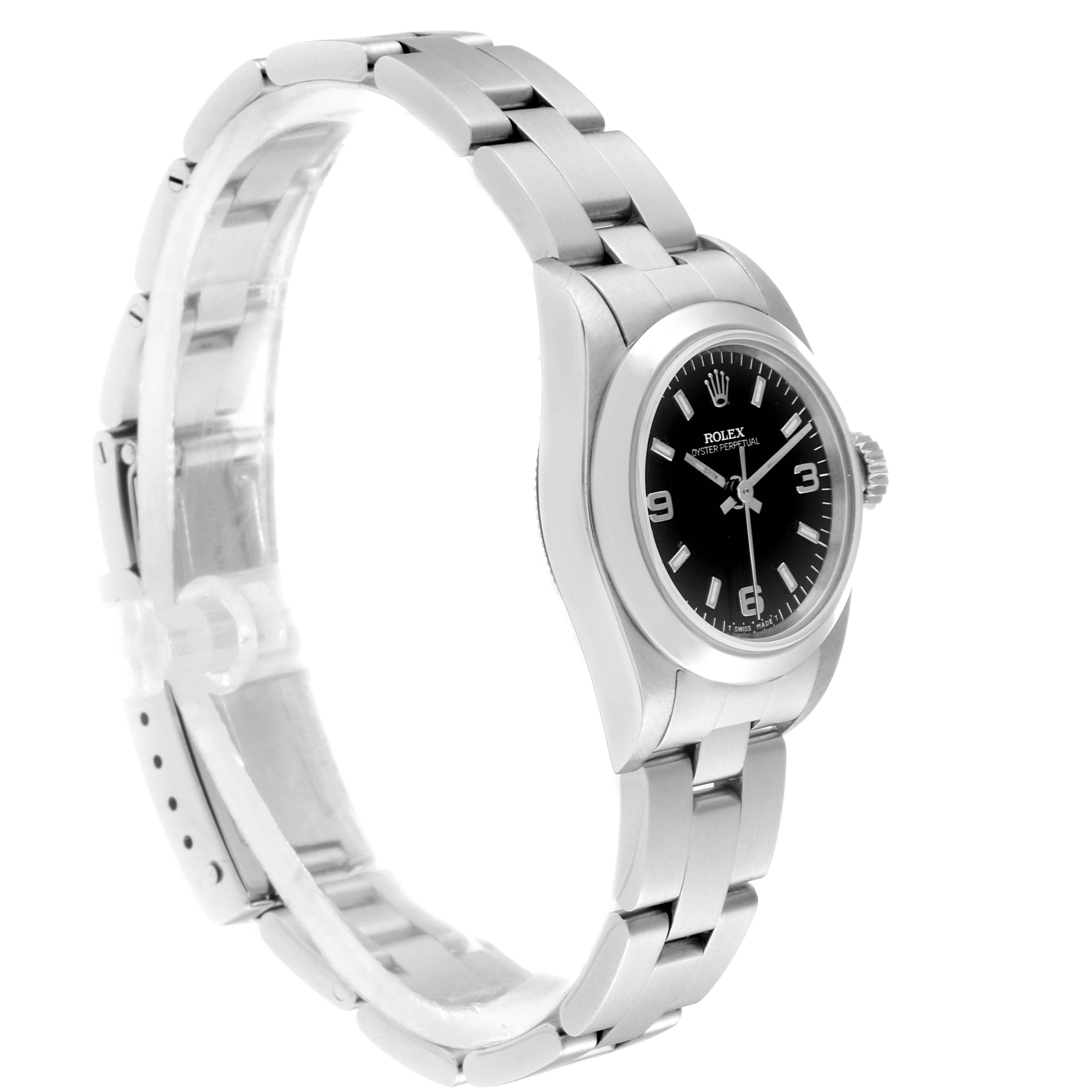 The Rolex Oyster Perpetual 67180 Women
s Stainless Steel Black Dial 67180 Women
s Stainless Steel Black Dial watch is shown from a side angle, displaying the dial, crown, and part of the bracelet.