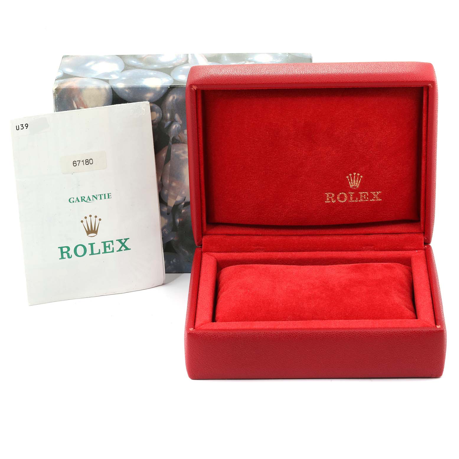 The image shows an open red Rolex box and a warranty booklet for the Oyster Perpetual model.