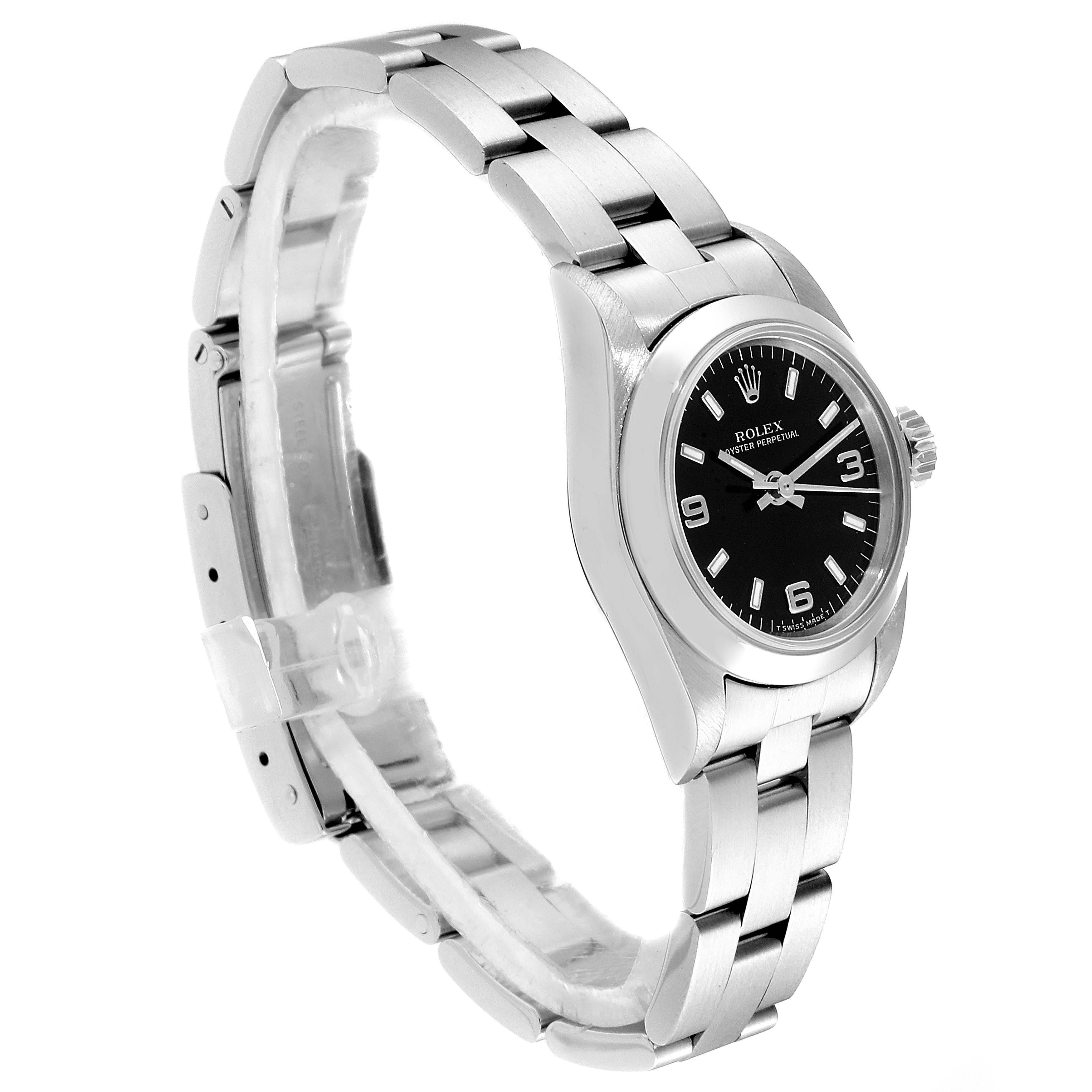 This image shows a Rolex Oyster Perpetual 67180 Women
s Stainless Steel Black Dial 67180 Women
s Stainless Steel Black Dial watch at a three-quarter angle, displaying the face, bracelet, and clasp.