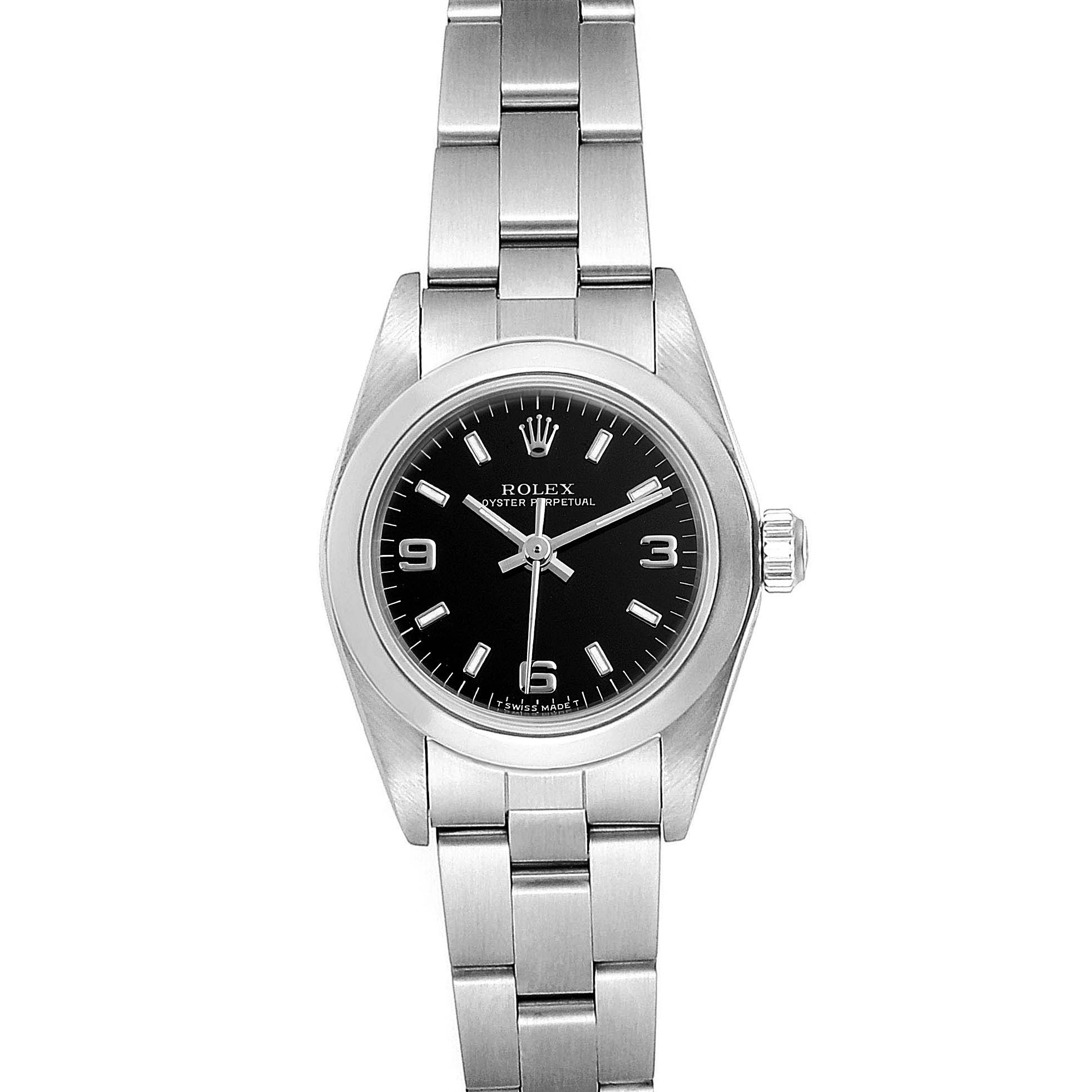 The image displays a Rolex Oyster Perpetual 67180 Women
s Stainless Steel Black Dial 67180 Women
s Stainless Steel Black Dial watch from a top-down angle, showing its full bracelet, case, crown, and dial.