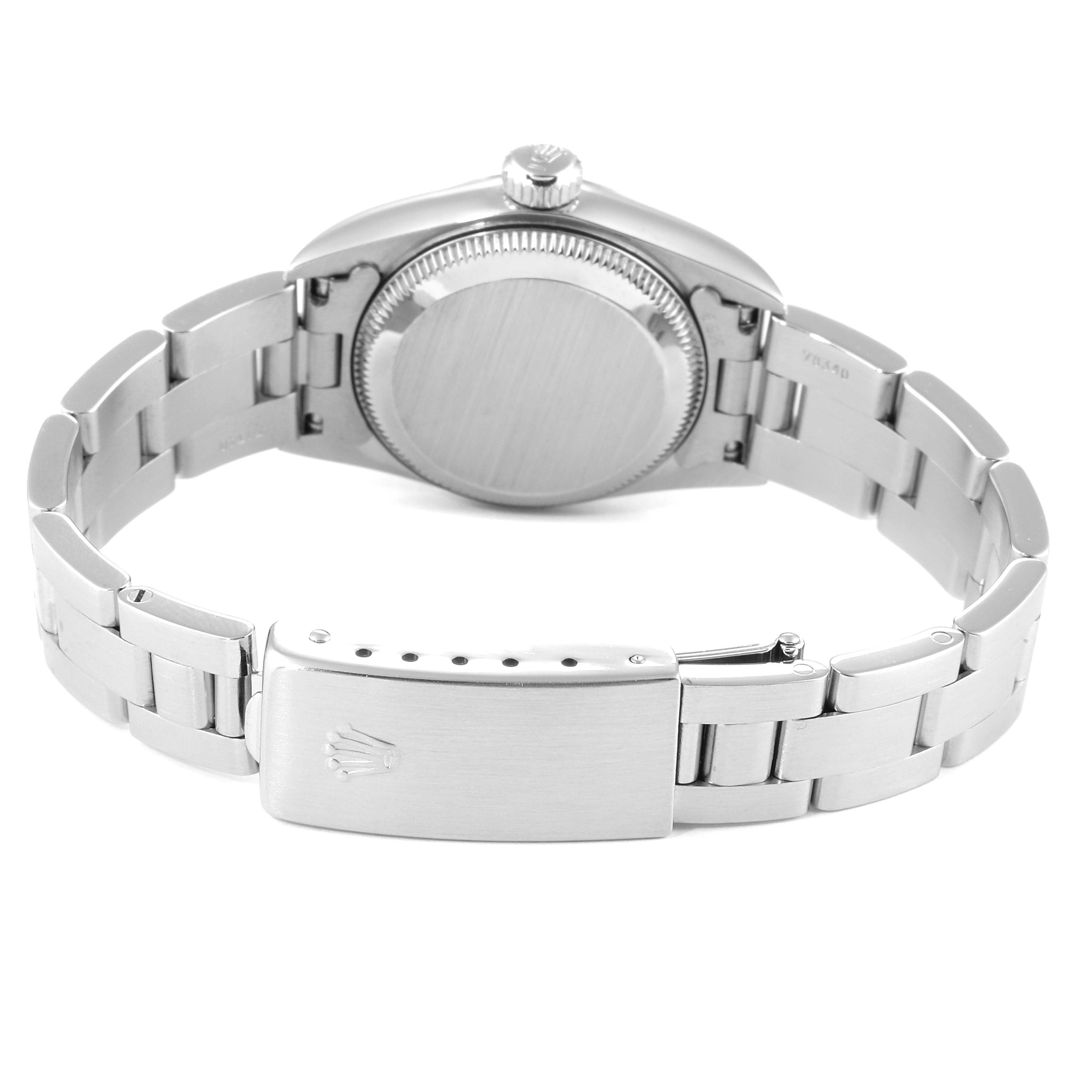 The image shows the back case, crown, and clasp of a Rolex Oyster Perpetual 67180 Women
s Stainless Steel Black Dial 67180 Women
s Stainless Steel Black Dial watch from a rear angle.