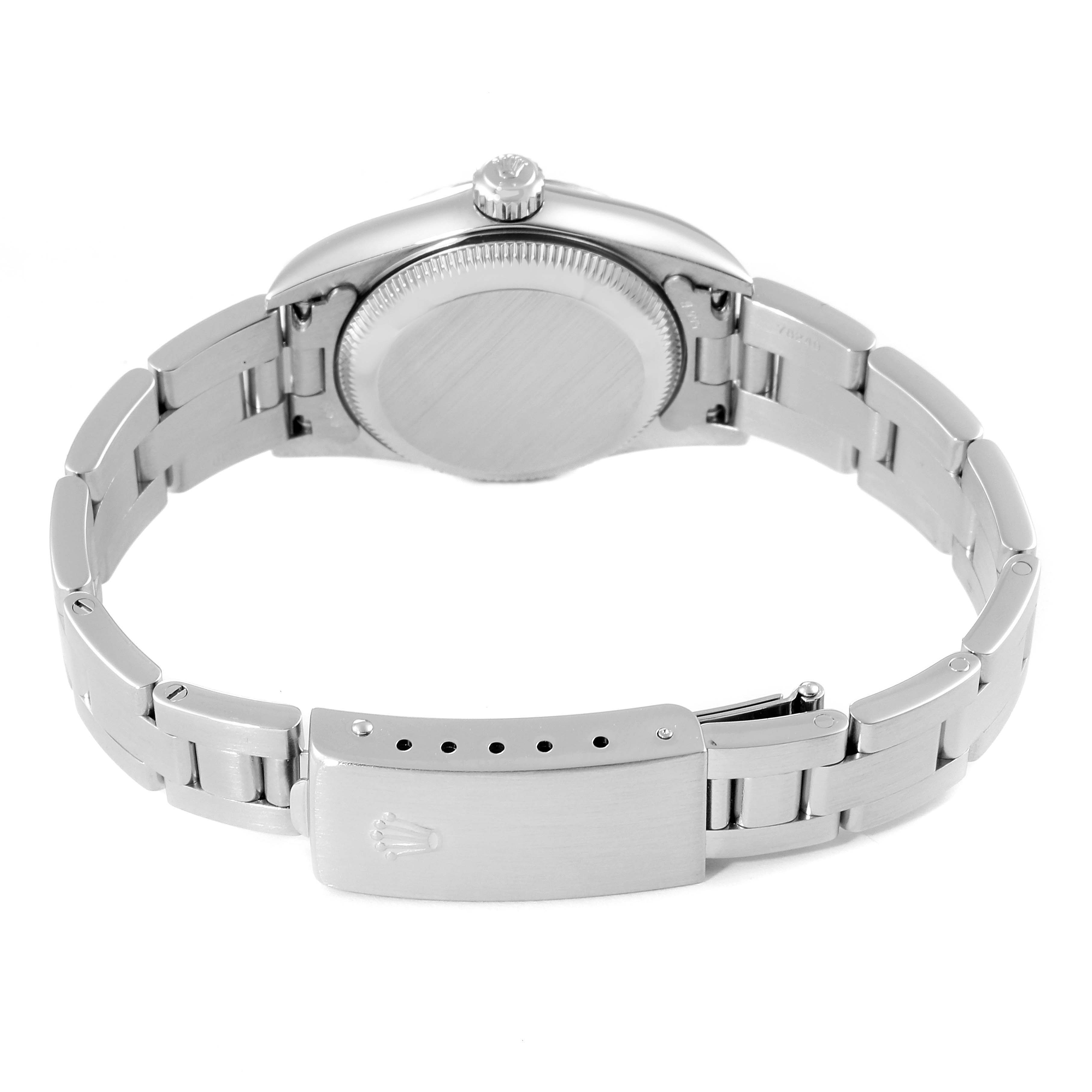 This image shows the back view of the Rolex Oyster Perpetual 76094 Women's Stainless Steel Black Dial 76094 Women's Stainless Steel Black Dial watch, highlighting its casing and metal bracelet with a visible clasp.