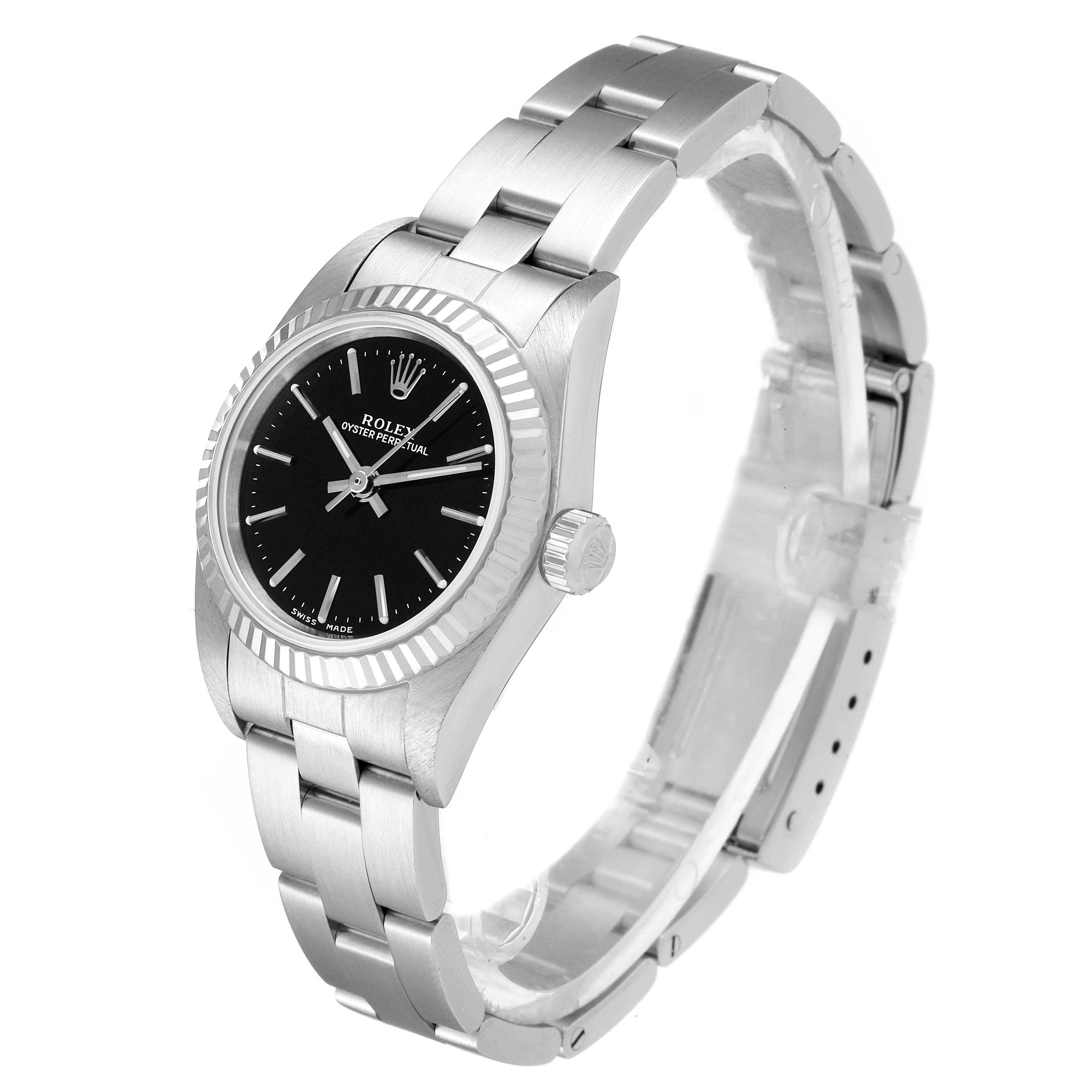 The image shows a side and partial top view of the Rolex Oyster Perpetual 76094 Women's Stainless Steel Black Dial 76094 Women's Stainless Steel Black Dial watch, highlighting its face, bezel, and metal bracelet.