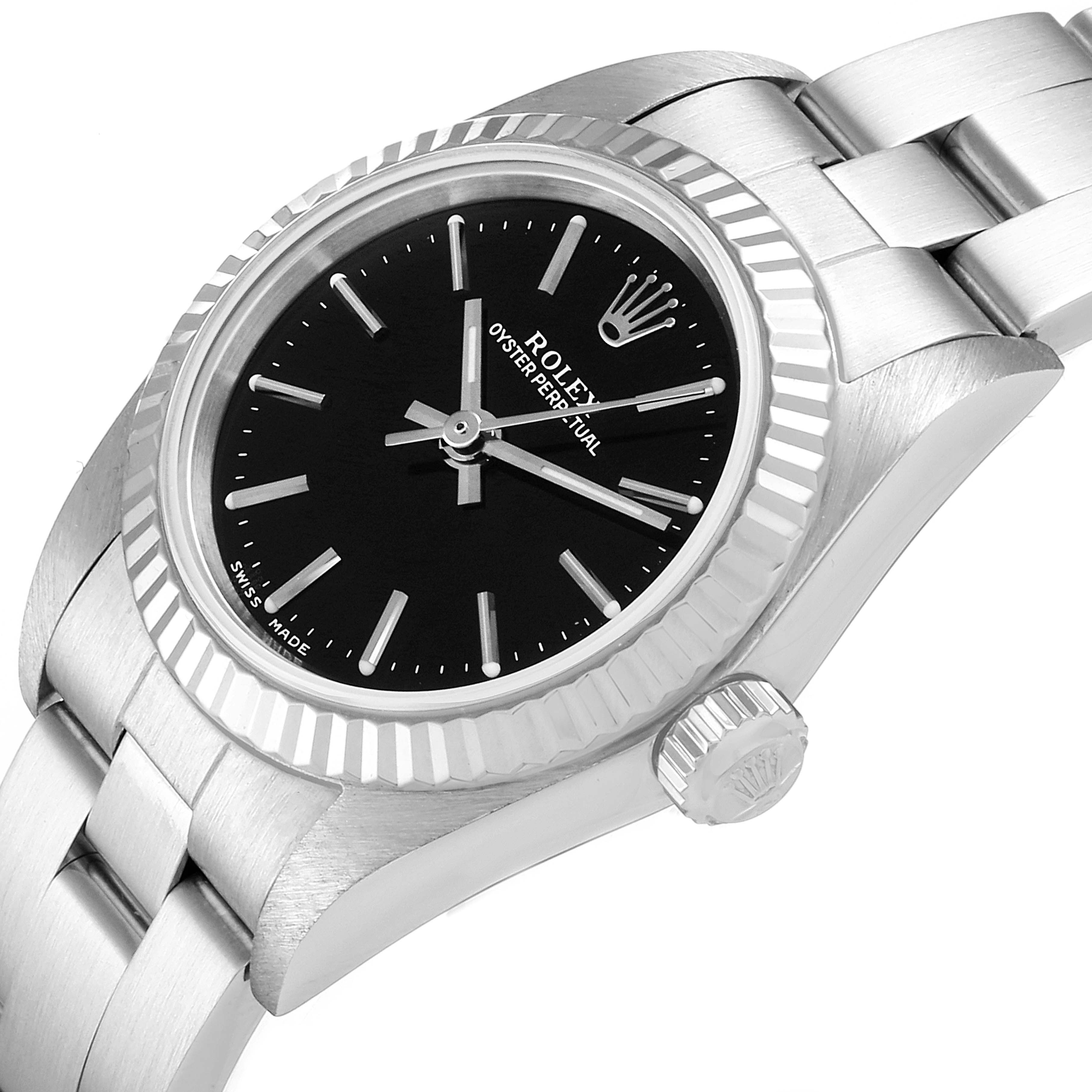 The image shows a Rolex Oyster Perpetual 76094 Women's Stainless Steel Black Dial 76094 Women's Stainless Steel Black Dial watch at an angle highlighting the bezel, dial, crown, and part of the bracelet.