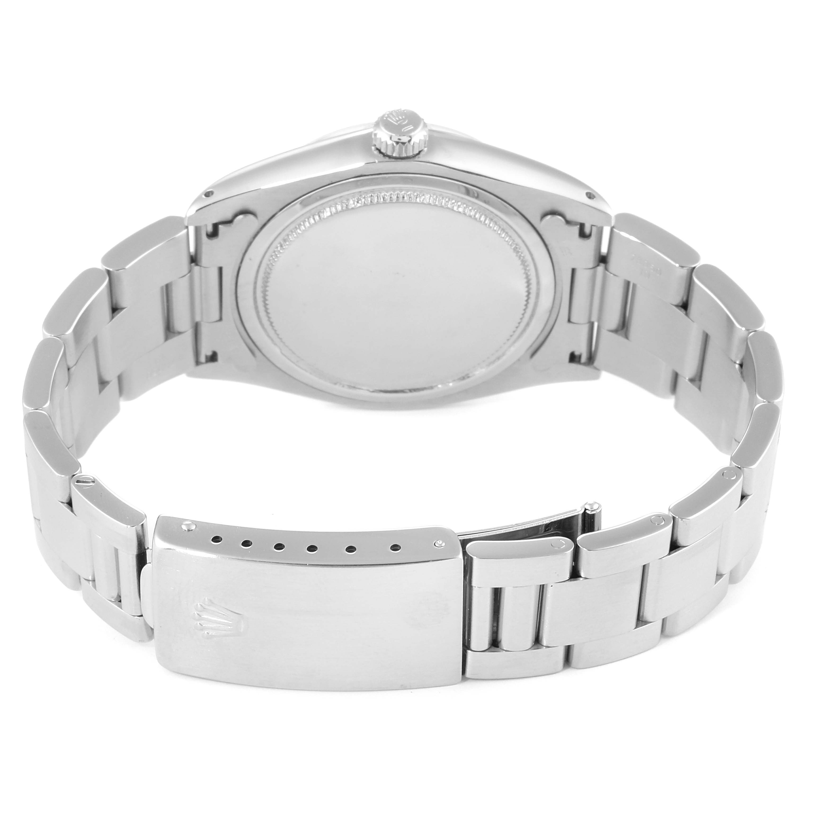 This image shows the back case and bracelet clasp of a Rolex Vintage Collection 6694 Men
s Stainless Steel Black Dial 6694 Men
s Stainless Steel Black Dial model watch at an upward-facing angle.