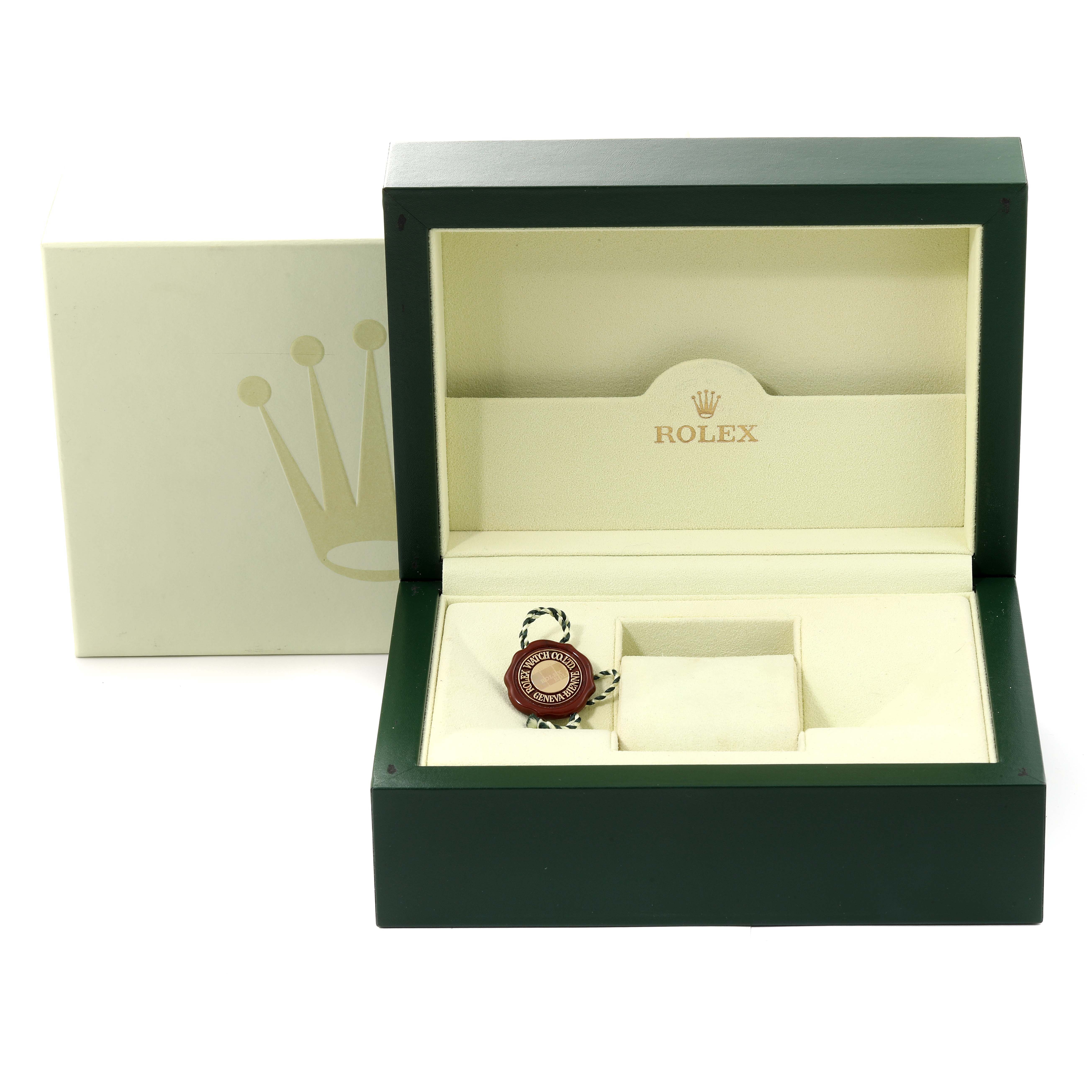 The image shows an open Rolex Pearlmaster 80318 Women's Yellow Gold Mother of Pearl Dial 80318 Women's Yellow Gold Mother of Pearl Dial watch box, revealing its interior with a tag but no watch inside.