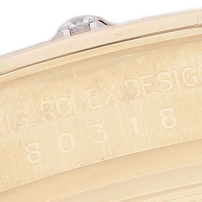 This close-up image shows the engraved side of the bezel and case of a Rolex Pearlmaster 80318 Women's Yellow Gold Mother of Pearl Dial 80318 Women's Yellow Gold Mother of Pearl Dial watch.