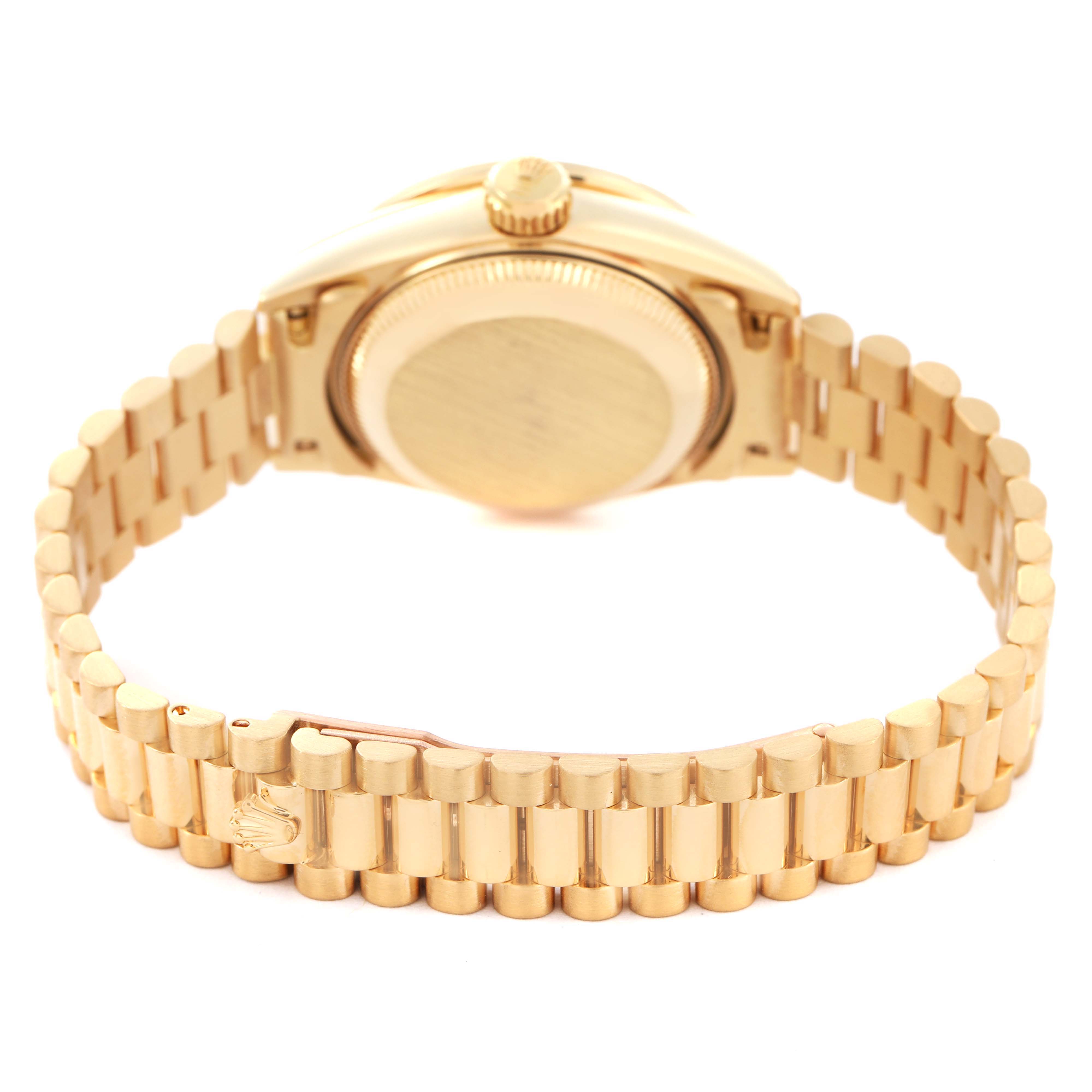 The image shows the back of a Rolex President 69138 Women's Yellow Gold Champagne Dial watch, highlighting the case back and gold bracelet from a rear angle.