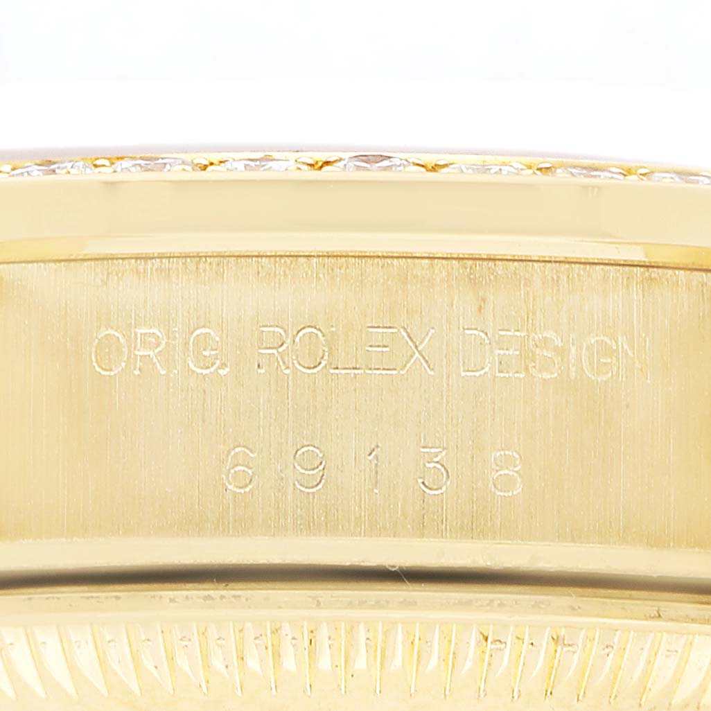 The image shows the side of a Rolex President 69138 Women's Yellow Gold Champagne Dial model, highlighting the engraved serial number and "ORIG. ROLEX DESIGN" text.