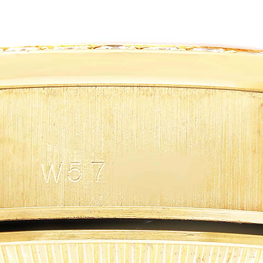 The image shows a close-up of the side of the Rolex President 69138 Women's Yellow Gold Champagne Dial watch, featuring its gold-toned casing.